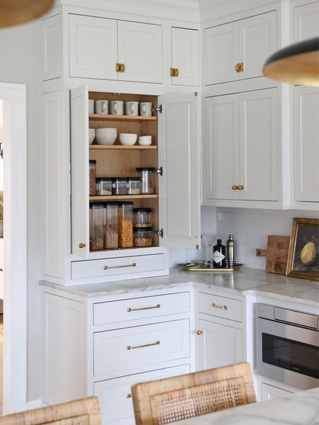 We do not have a pantry so we had to make full use of cabinet space. This corner of the kitchen serves as our main pantry for cereal and snacks. The containers are from Amazon. All of the unlacquered brass hardware is from Rejuvenation.

#LTKstyletip #LTKFind #LTKhome