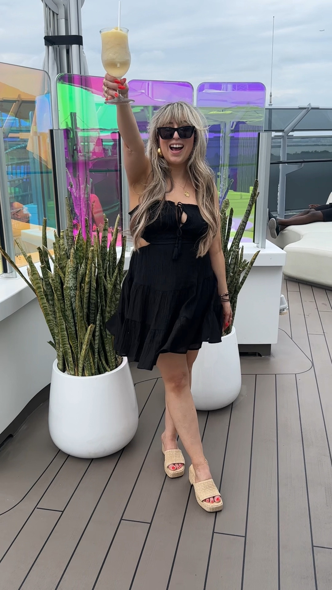 What I wore on my virgin voyages cruise - This black sundress is perfect for a summer or spring outfit! Wore this little Amazon sundress to board the cruise and got so many compliments. Super stretchy back and very forgiving, I ordered a size small. Paired with straw mules that were so comfortable and perfect for beach vacations, cruises, or spring and summer outfits. THE PERFECT STRAW SANDAL! Great quality summer sandals for sure. Wearing my true size. 

#LTKfindsunder50 #LTKtravel #LTKSeasonal