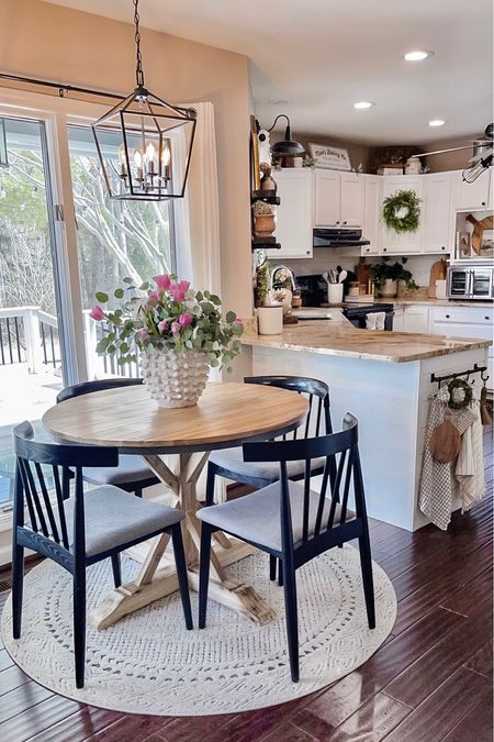 Breakfast Nook Views. Follow @farmtotablecreations on Instagram for more inspiration. Round wood table. Dante Dining Chair. Floral Centerpiece. Anthropologie Vase. Kitchen Decor  

#LTKhome #LTKunder100 #LTKFind