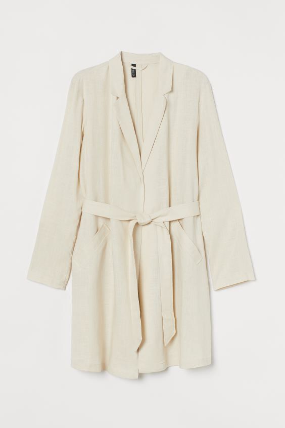 Knee-length trenchcoat in a woven viscose and linen blend. Notched lapels, gently dropped shoulde... | H&M (US)