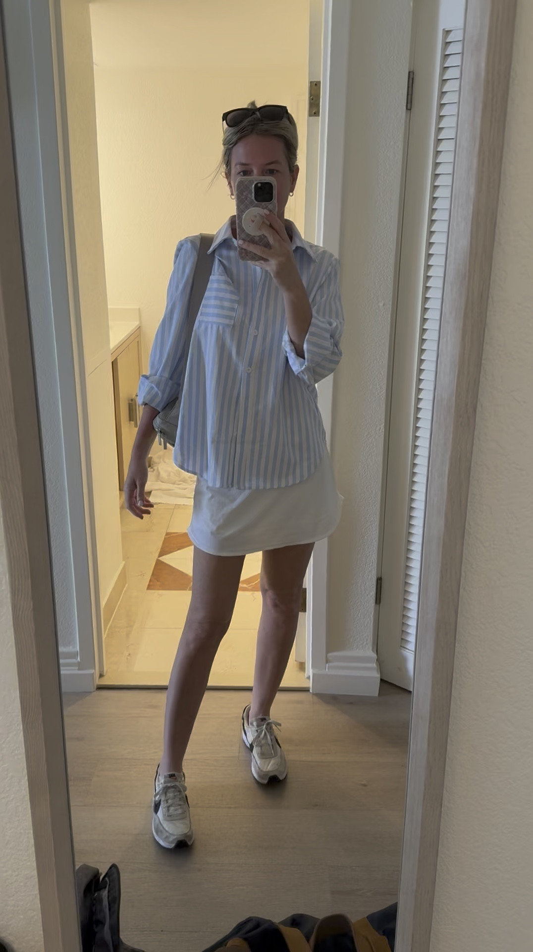 Airport outfit ✈️🌊 love this steffi active skirt and button down shirt for comfort while traveling. 

#LTKActive #LTKTravel #LTKFitness