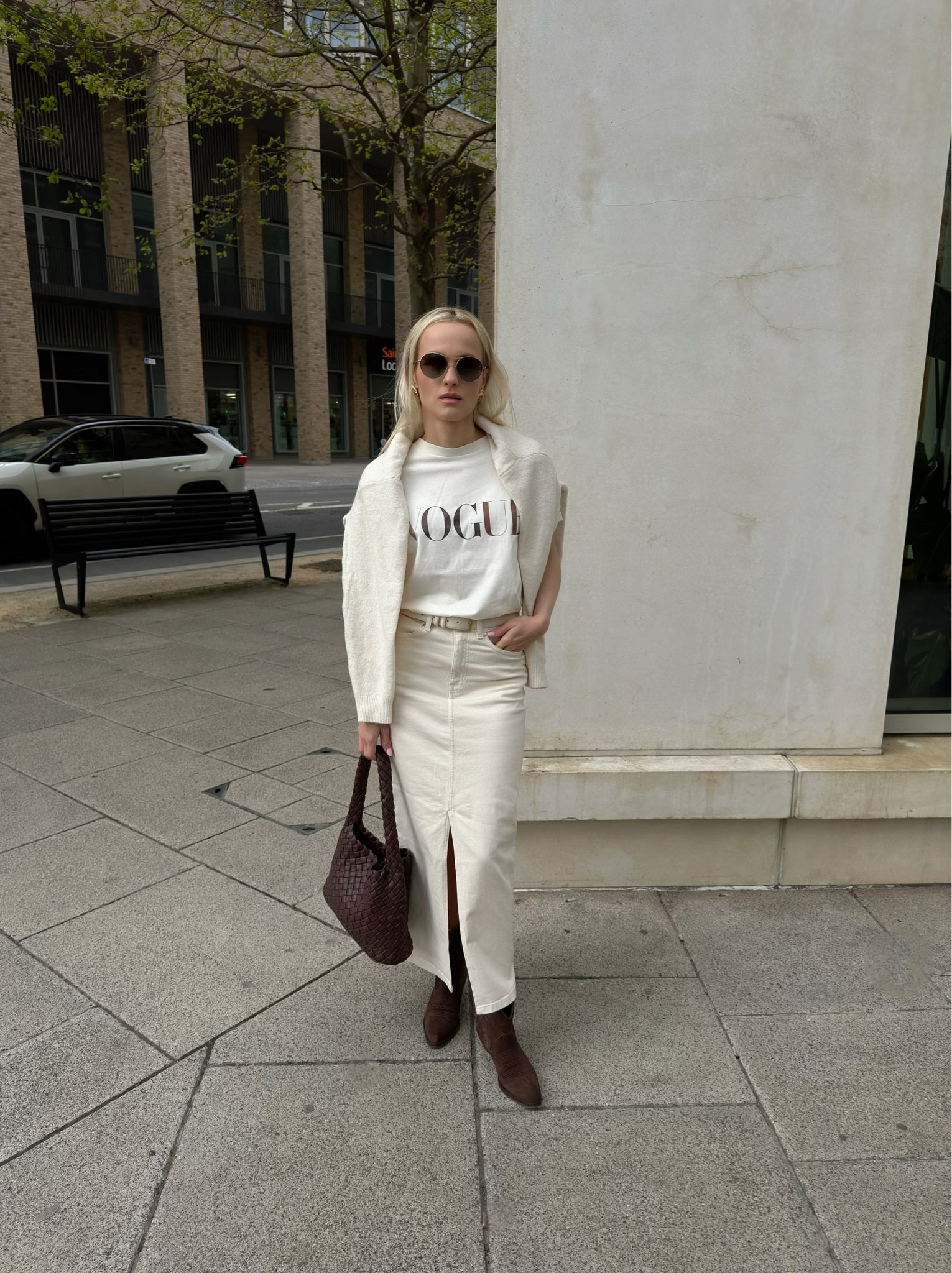 Styling Exlusive Aurora James x Vogue T-Shirt !!

Neutral colour attire perfect for those who likes minimalist day look. 
Chanel brown round aviator shape sunglasses, H&M gold earrings , Massimo Dutti ecru sweater, Vogue ecru T-shirt, Cos ecru belt, Asos ecru denim skirt, Mango brown braided tote bag, Ba&sh brown suede leather western boots.

#LTKstyletip #LTKeurope #LTKSeasonal