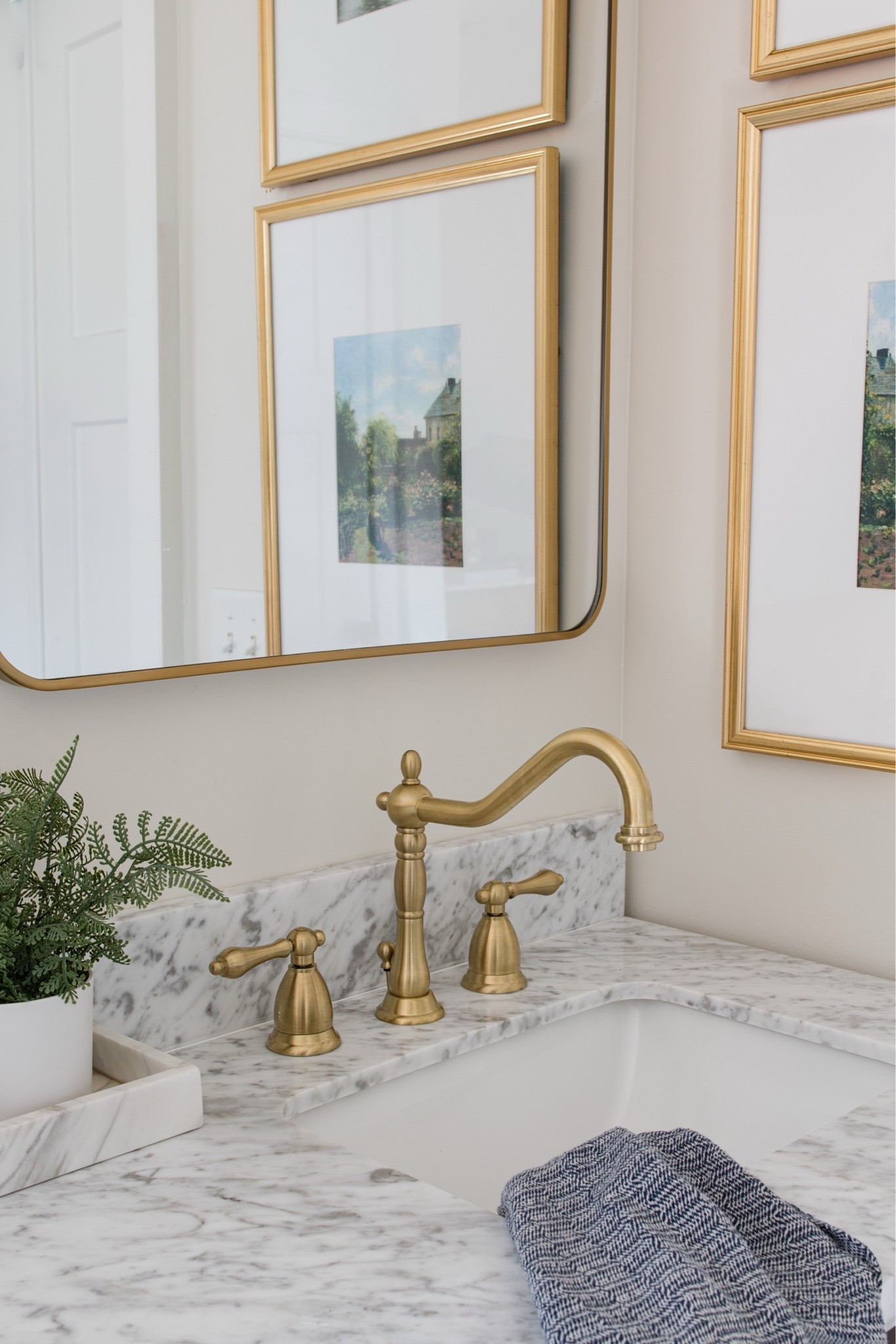 Bathroom remodel with marble top vanity and brass faucet

#LTKHome #LTKSeasonal #LTKdayinmylife