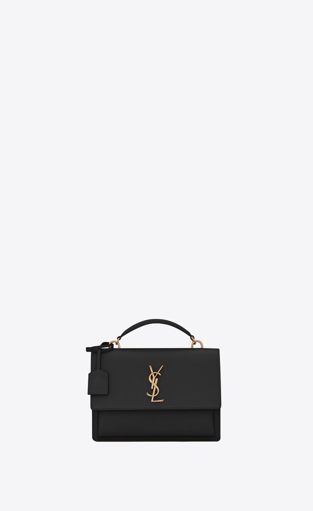 medium satchel bag with front flap decorated with metal YSL initials, featuring a leather top han... | Saint Laurent Inc. (Global)