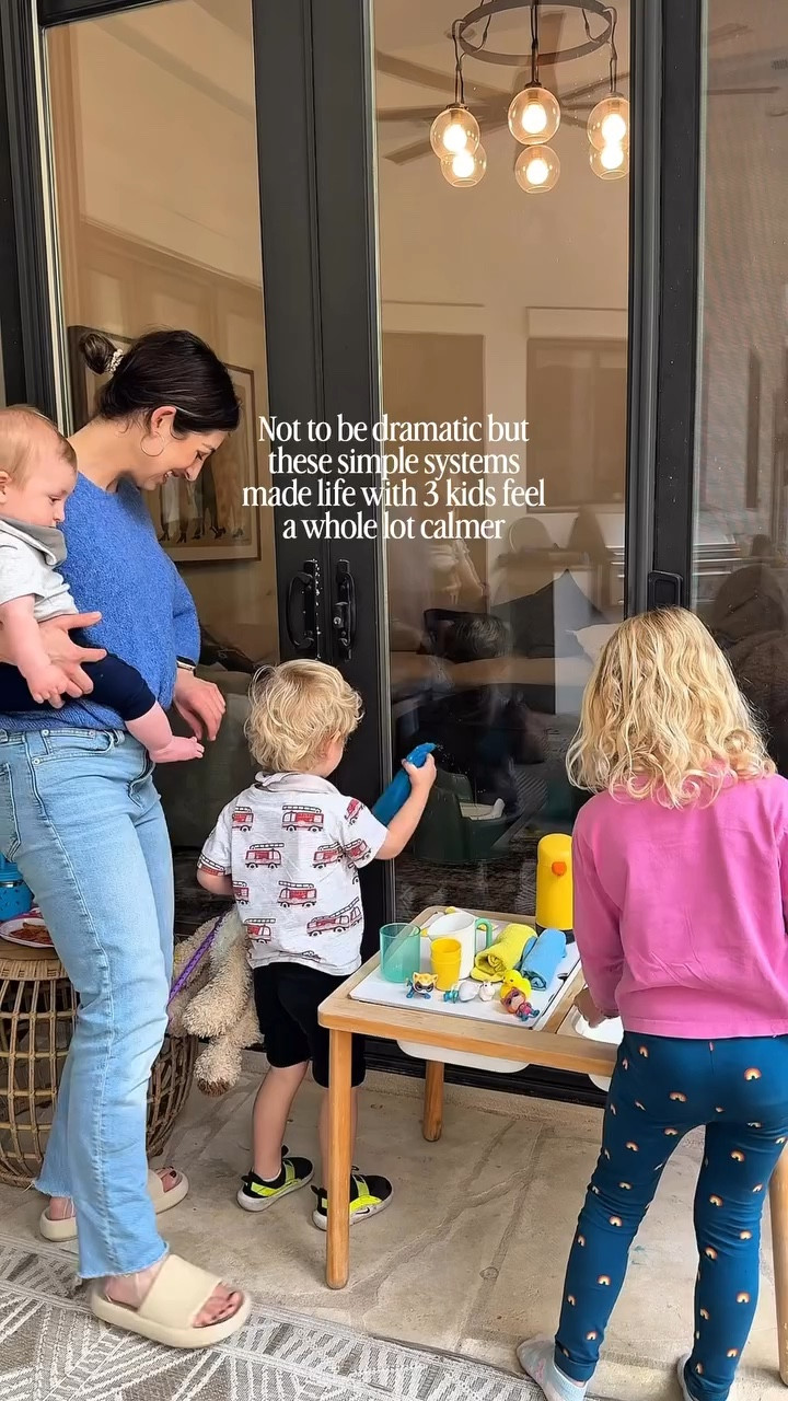 The biggest lesson the 3rd baby taught me was that we need better systems.

A few that make the biggest difference right now:

After school activity & snack dinner
The kids know are hangry when they get home. The want to snack & watch a show. Having a balanced snack as dinner and invitation for them to do independent play has dramatically cut down on the Mel downs.

Toy baskets everywhere 
Instead of organizing toys constantly, everything goes back into simple baskets & binslocated in every room. Fast resets > perfect organization.

Clothes at kid height
My daughter can choose and get dressed herself because everything is accessible to her. That saves time getting out the door in the mornings. 

Garage drop zone
Backpacks, shoes, and all the “coming and going” stuff lands here instead of spreading through the house.

Fridge calendar
A quick visual of the week so everyone knows what’s happening without me being the human reminder system.

None of these systems are complicated.
But together they make our home run a lot more smoothly.

Save this if you’re trying to make life with kids feel a little easier.

#organizedhome #organizedmom  #momtips