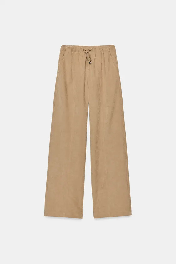 High-waist trousers with an adjustable elastic drawstring waistband. Featuring front pockets, fal... | Zara UK