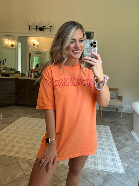 Beach bum tee. ☀️ comfort colors - so soft & comfy! Sized up 2 for a very oversized fit that is perfect for lounging & sleeping and super cute w bike shorts. 🤌🏼 ⭐️ code MORGAN works for 25% off. ⭐️

💄 lip liner shade “fill me in”
Lip gloss shade “coconut” 🥥 

#LTKsalealert #LTKunder50 #LTKFind