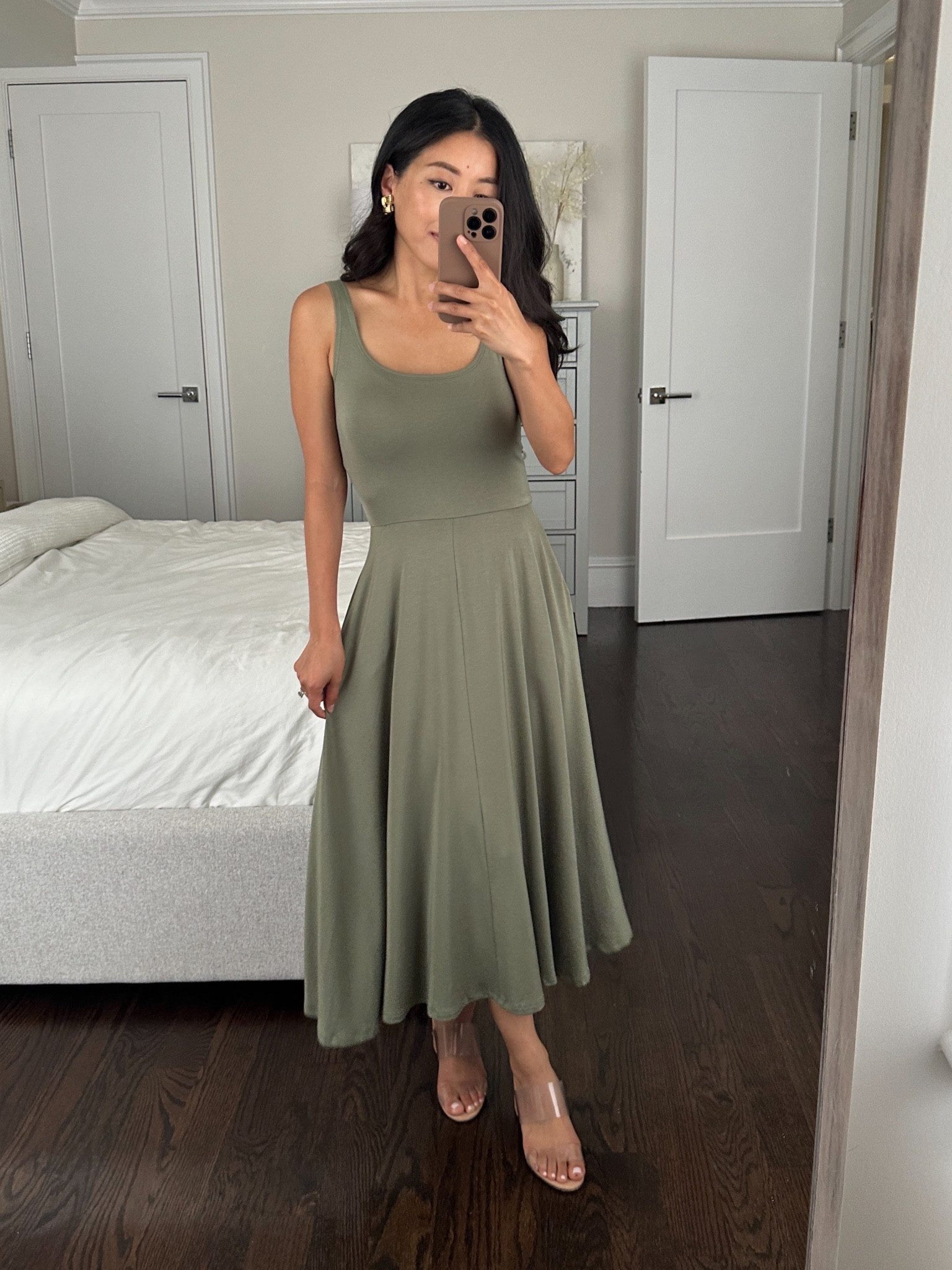 If you’re into simpler comfy pieces, this under $50 soft jersey knit dress with pockets comes in both a midi and a shorter knee length! This is the midi 

• Quince Jersey knit dress xs. Can be worn with a regular bra. Tried on both the lighter and darker green (see in a separate LTK post) 

I also linked a cotton poplin dress that is great on me in Xs and very comfortable and breezy. 

And a white linen fit and flare dress that is so pretty and classic but too big on me at the chest and torso in XS - still wanted to share for others since it has adjustable straps would suit someone who is usually XS petite and up. 

• Schutz clear comfy block heel sandals 5.5

#petite summer casual dress

#LTKtravel #LTKfindsunder50 #LTKSeasonal
