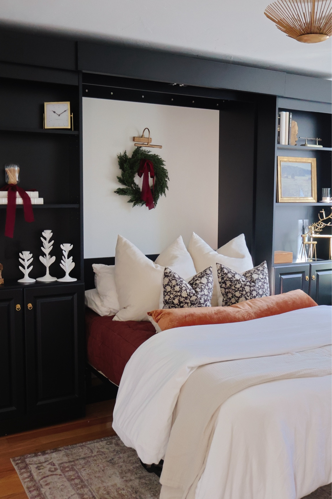 Guest room decorated for Christmas with faux wreath hanging over the bed with burgundy ribbon!

#LTKHoliday #LTKSeasonal #LTKHome