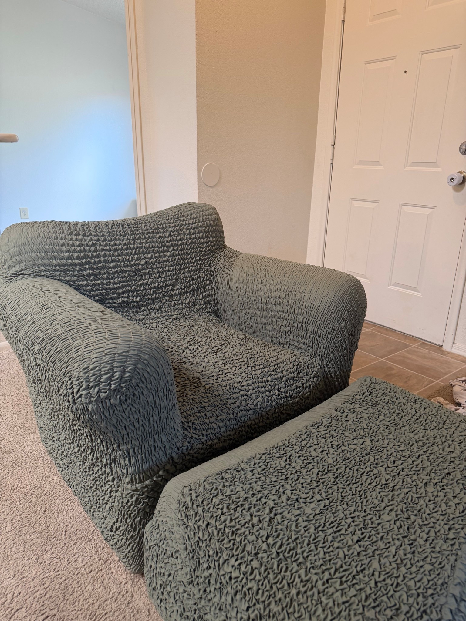 We recently just got this slip cover to give a temporary facelift to our very old beat up arm chair 