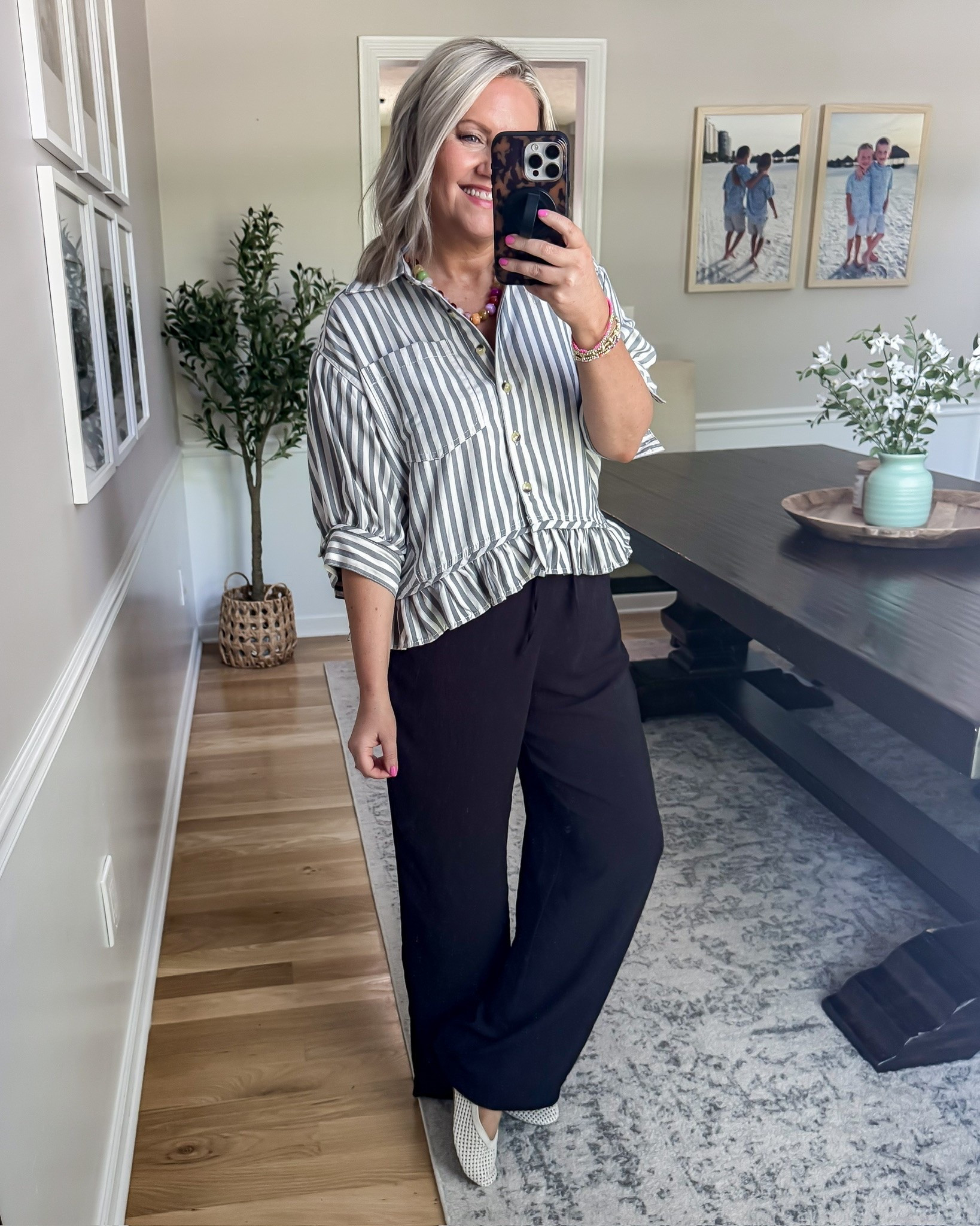 Such an easy outfit for days when you want to look put together but still stay comfy. The striped ruffle top is lightweight and flattering, and these flowy black pants can easily be dressed up for work, dinner, church, or everyday plans. I love how effortless this whole look feels while still looking elevated.

striped blouse outfit, black wide leg pants, casual chic outfit, spring work outfit, teacher outfit idea, comfy dressy outfit, effortless everyday style, business casual outfit, lightweight spring top, neutral outfit idea, classy casual look, wide leg pant outfit, lovelylifestyling

#LTKootd #LTKOver40 #LTKWorkwear