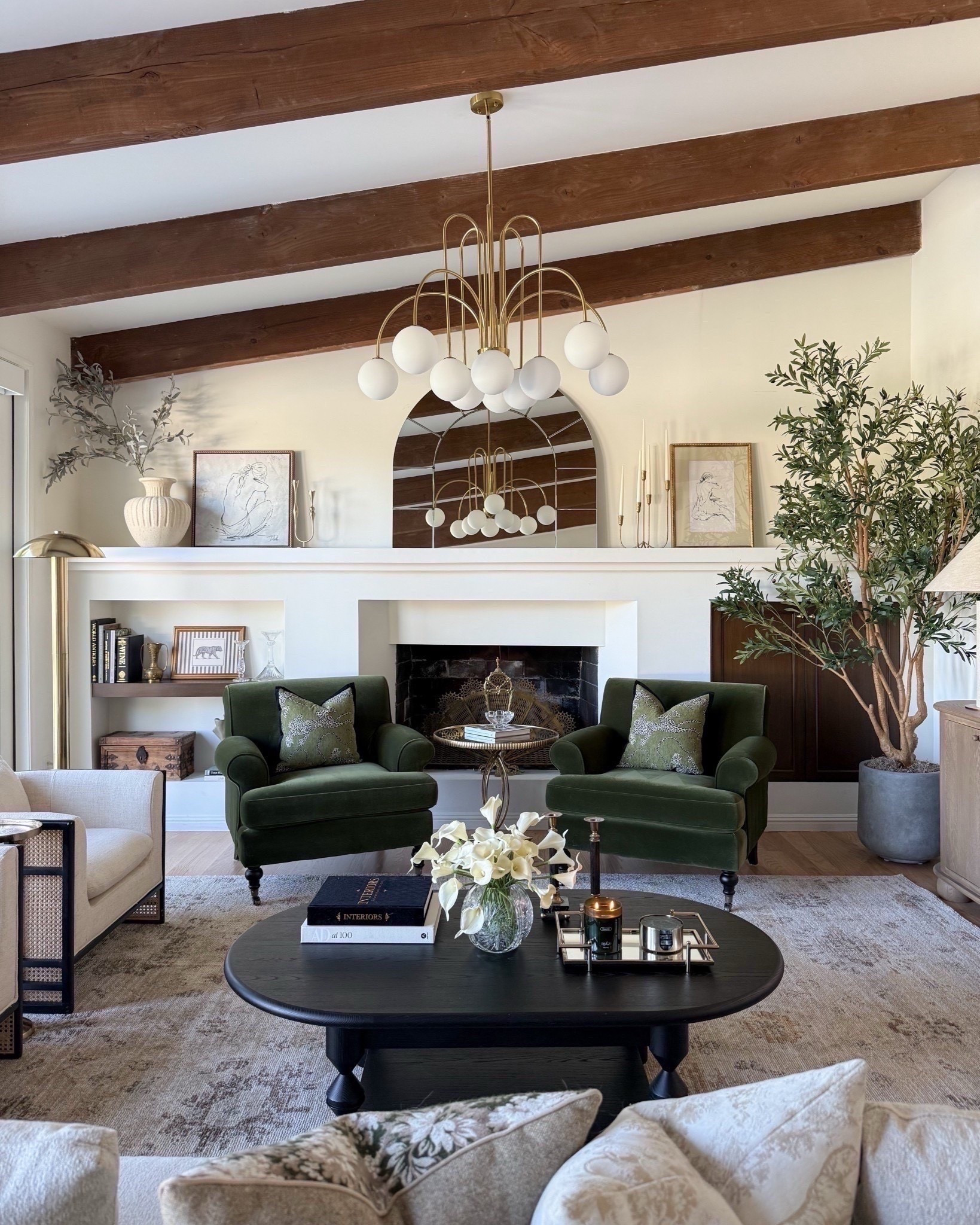 Our living room decor! Love this statement chandelier and accessories to give this space a modern art decor style that blends so well with the other designer details of our home!

#LTKFindsUnder100 #LTKHome #LTKFindsUnder50