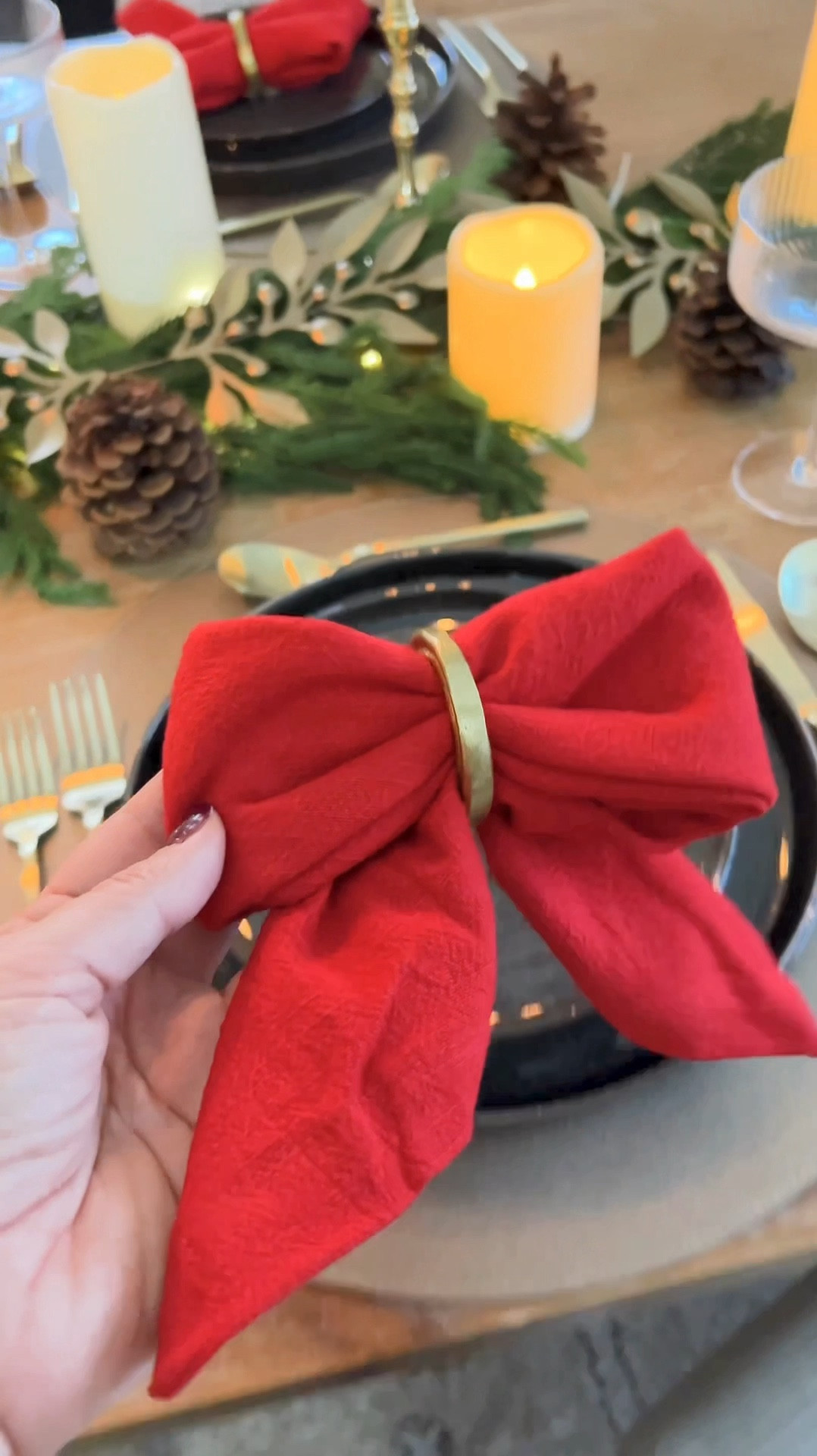 Nostalgic red and green are trending this season, and I’m here for it! Adding a touch of tradition to your holiday table is easier than ever with this napkin bow tutorial:

Fold your napkin into a triangle and then into a long rectangle piece.

Hold the napkin horizontally and fold each end into the center to create bow loops.

Slide the entire napkin through a napkin ring to secure the center and form the bow.

Adjust and fluff the loops for a perfect, festive finish.

This simple yet stunning detail will make your table feel special and full of holiday cheer! ♥️🎄

#LTKHoliday #LTKSeasonal #LTKHome