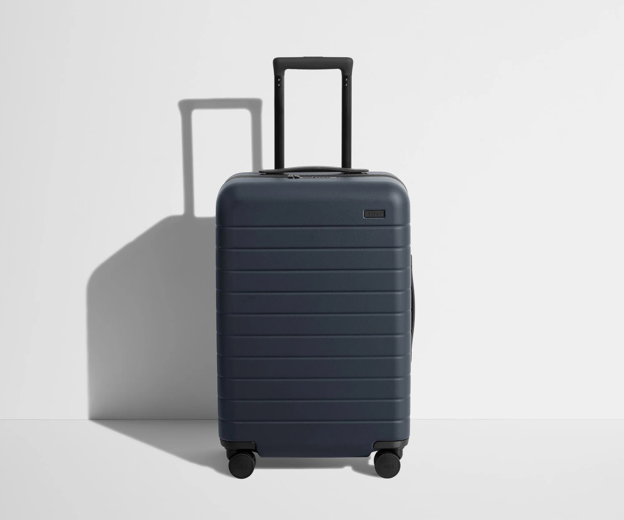 Shop The Bigger Carry-On suitcase in Navy Blue | Away | Away