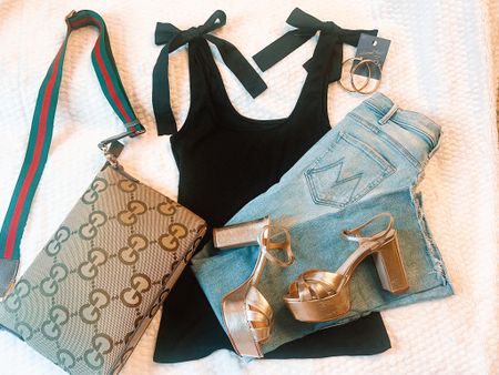 Friday Flat-lay! It’s a summer Friday! 
This outfit is a perfect high-low mix!
I love this adorable tank top with bows. It’s under $15! Paired with my favorite lighter wash jeans and platform sandals.
Jeans, denim, platform, sandals, platform sandals, Gucci, Mother Denim, metallic, metallic sandals, messenger bag, Target, hoops

#LTKFindsUnder50 #LTKItBag #LTKStyleTip