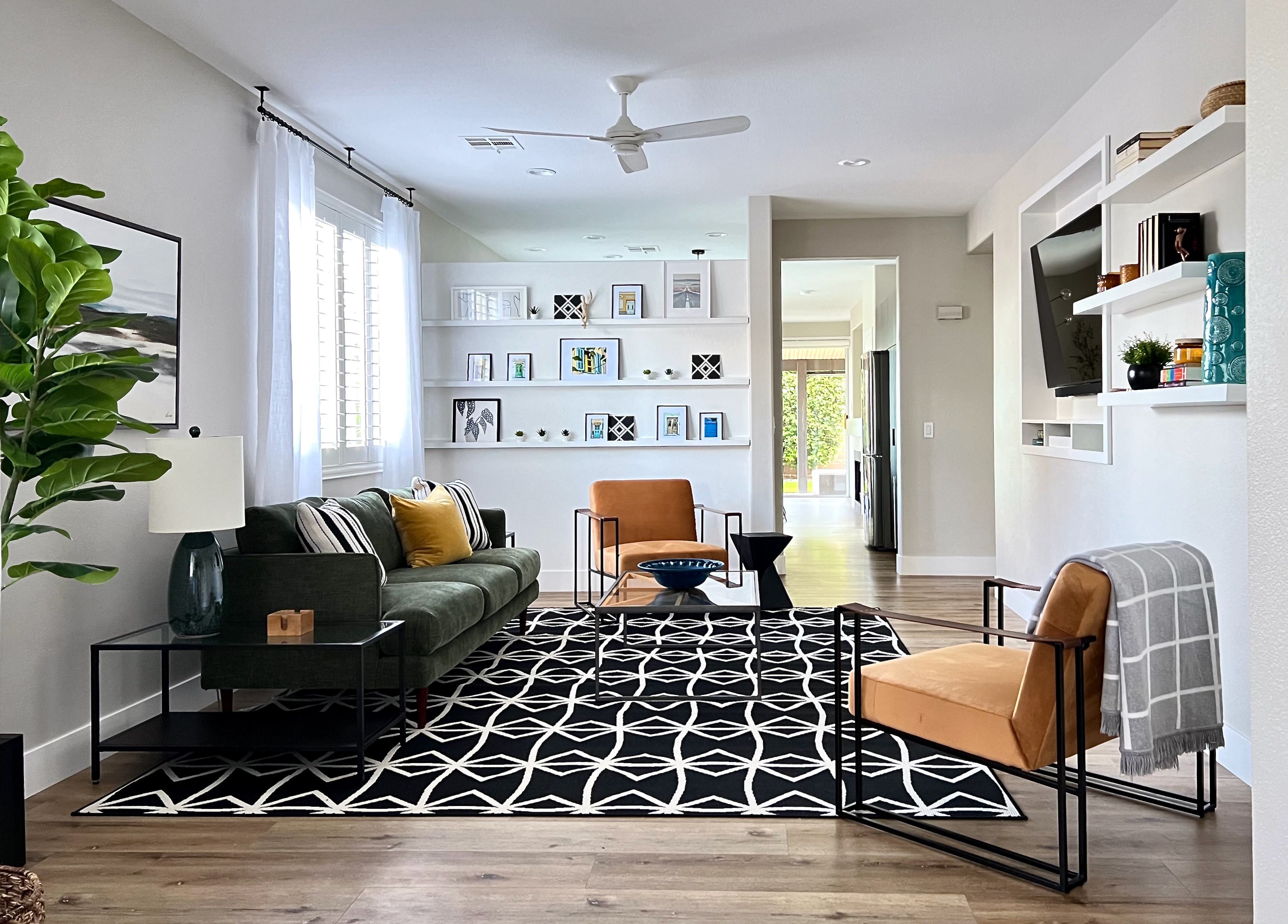 Modern Comforts in Our Airbnb Stay 🖤✨
Designed for both style and function, this Airbnb features a bold, inviting living area with a forest green sofa, warm leather chairs, and a graphic black + white rug that makes a statement. The dining space centers around a wood table paired with sleek black chairs — perfect for group meals or game nights. And for those working remotely? The spacious office setup with a large table offers a comfortable, productive zone.

🏡 I’ve linked similar finds and exact pieces (where possible) on my LTK so you can bring the look home or to your own rental space. 

 #AirbnbStyle #LTKHome #DressYourSpaceBySandraMijan #ModernDesign #VacationRentalVibes #LTKLivingRoom #LTKOffice #LTKDining #LTKHome #LTKStyleTip #LTKFamily