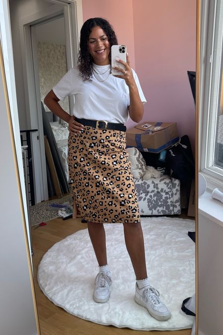 Casual summer office outfit with a midi length leopard pencil skirt (I’m 5’11”) and an oversized white abercrombie tee tucked in. A thick belt, ruffled socks, and white Air Force one sneakers complete the look!

#LTKstyletip #LTKSeasonal #LTKworkwear