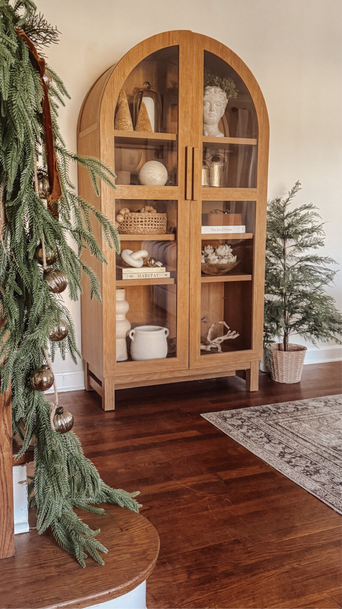 Arch cabinet on sale - under $300 ✨ Here’s how I styled it in my home for the holidays with neutral Christmas decor 🌲

#LTKHome #LTKHoliday #LTKSaleAlert