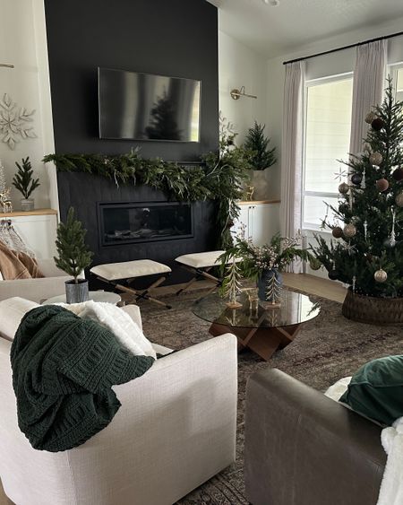 Christmas living room decor, McGee and co Christmas tree, swivel chairs, fur blankets, upholstered stools, coffee table, gold trees, Walmart Christmas 

#LTKhome #LTKHoliday #LTKstyletip