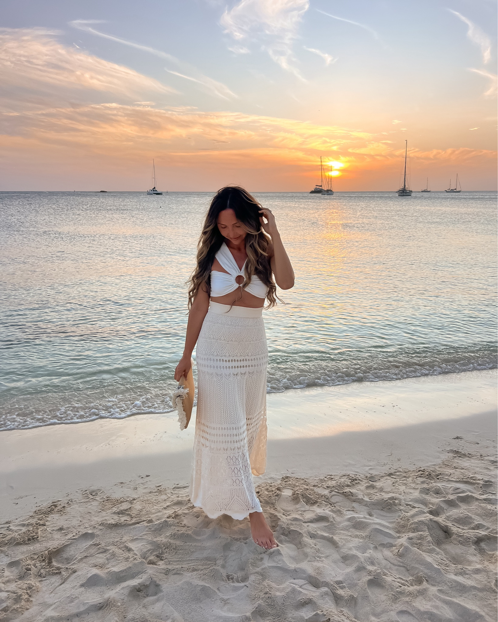 Vacation outfit inspo - I wore this outfit for a beachfront dinner we had in Aruba. Love this sexy cutout o-ring crop top from Revolve & this crochet maxi skirt from Amazon (wearing size XS--comes in more colors & it also looks great styled as a strapless midi dress or swim coverup)

// summer date night outfit, vacation outfit, resort wear, resort outfit, crochet skirt, coverup skirt, cover up skirt, beach outfit, beach skirt, Revolve, Amazon fashion

#liketkit 

#LTKFindsUnder100 #LTKStyleTip #LTKItBag #LTKSwim #LTKFindsUnder50 #LTKTravel