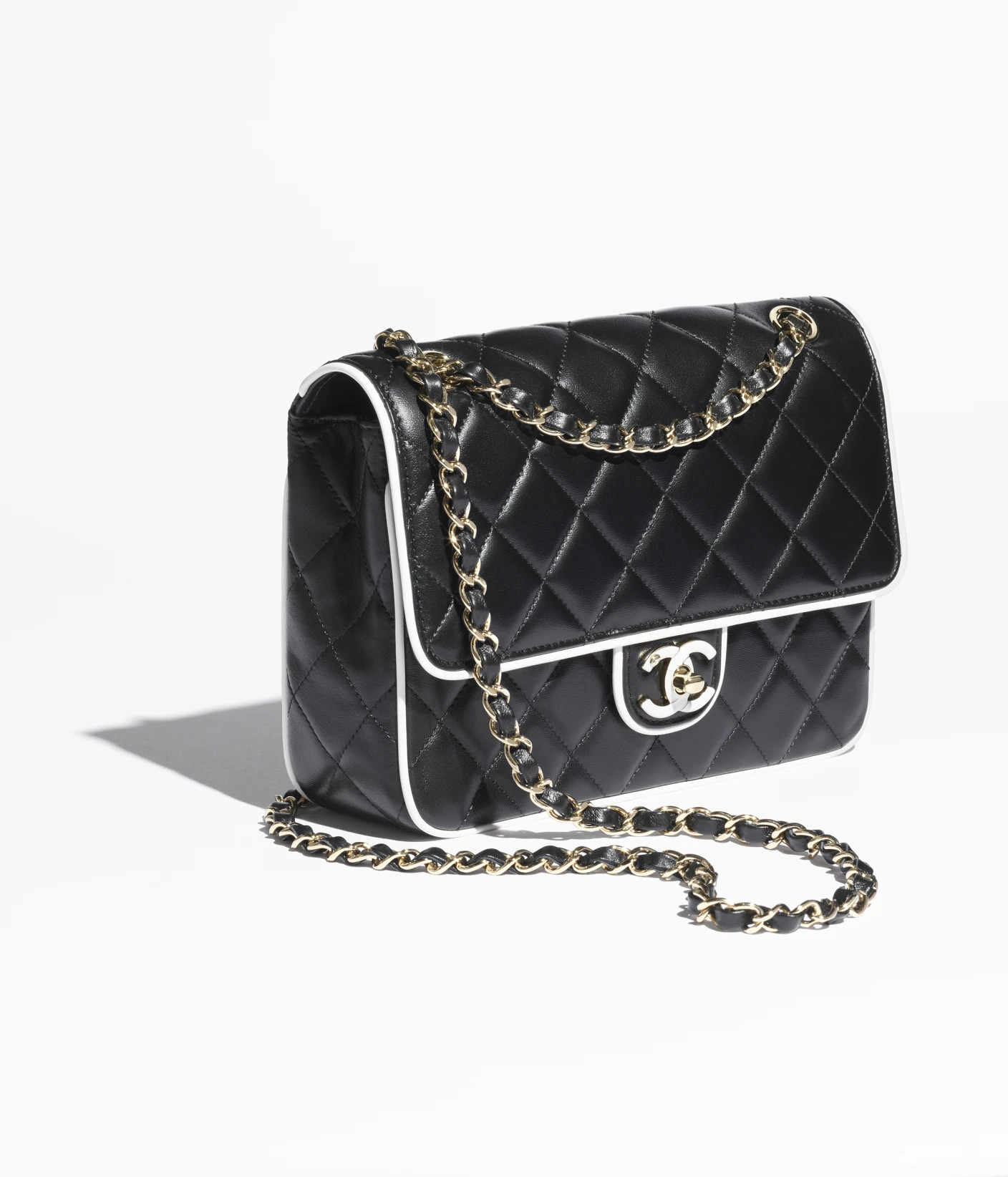 Flap bag, Lambskin & gold-tone metal, black & white — Fashion | CHANEL | Chanel, Inc. (US)