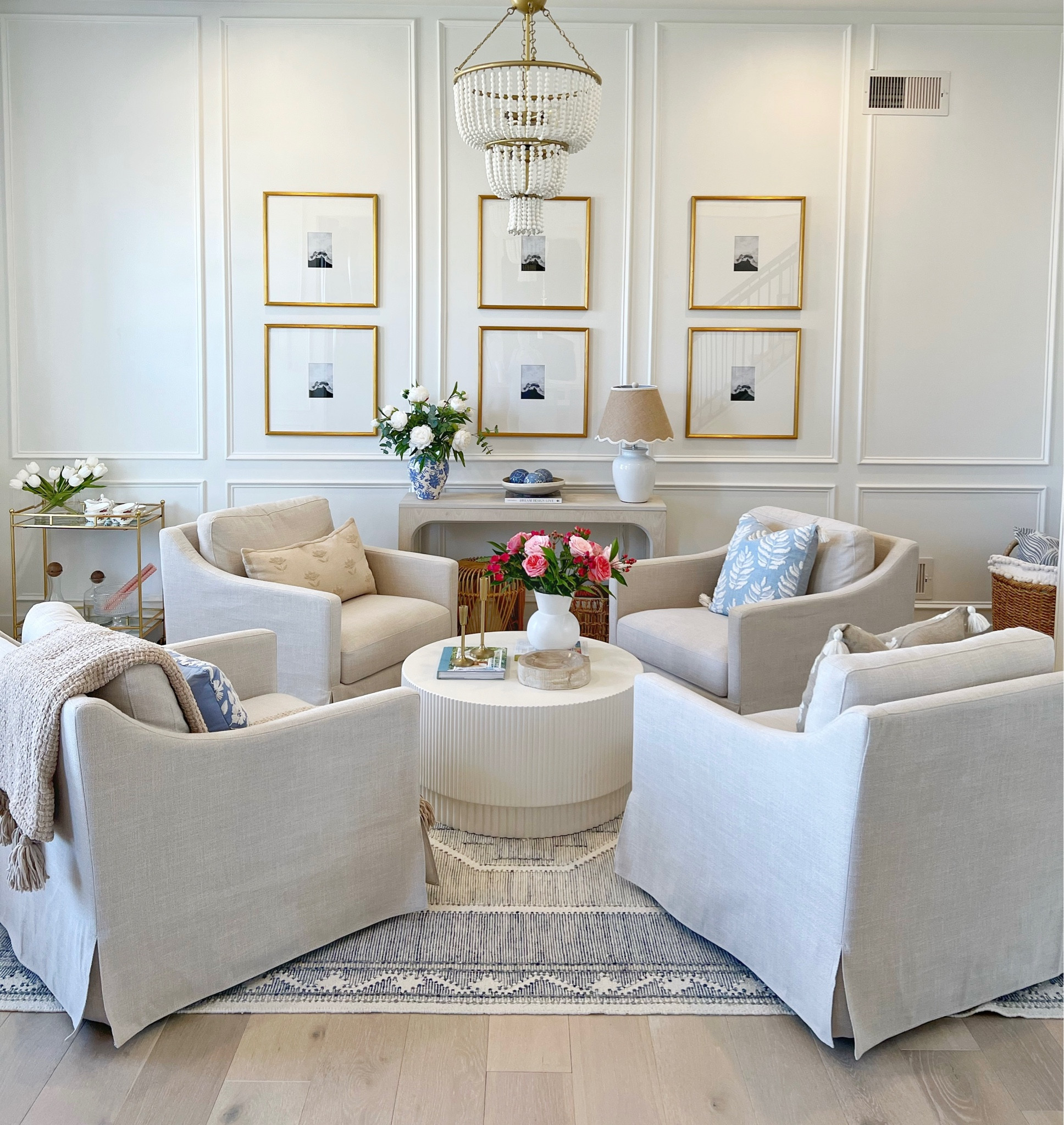 Target, Target home, Target finds, West Elm, upholstered accent chairs, wall gallery, gold picture frames, console table, beaded chandelier, blue and white decor

#LTKhome