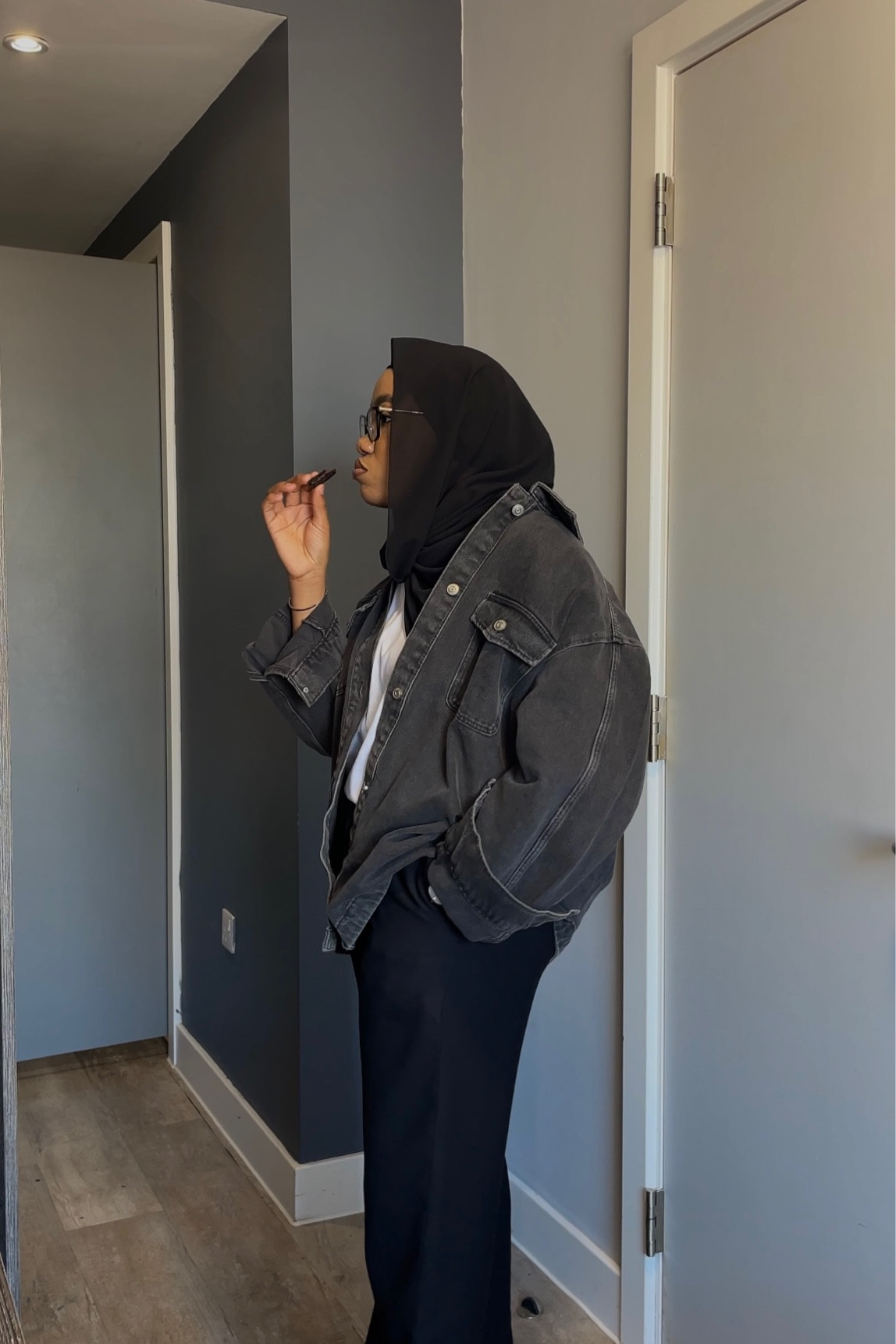 Modest black denim jacket outfit idea, oversized black denim jacket outfit modest spring summer outfit ideas black pants outfit modest black pants outfit inspo styling black pants stylimg oversized denim jacket styling black denim, oversized denim jacket modest outfit idea