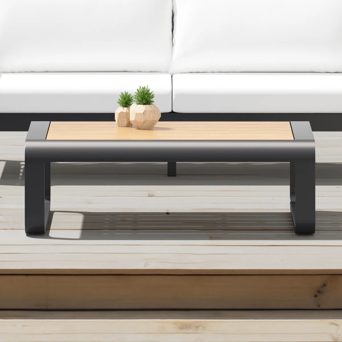 This rectangular outdoor coffee table from Wayfair has such a clean, easy patio look. I love the warm wood-look slatted top paired with the chunky black frame, especially styled in front of a crisp white outdoor sofa. Such a versatile piece for a deck, patio, or backyard lounge area.