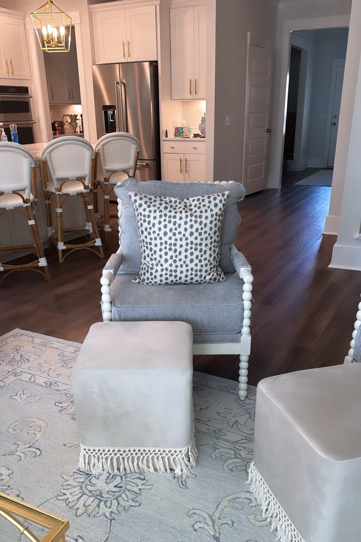 Spindle chair
Fringe ottoman 
Blue rug
Counter stools
Grandmillenial 

#LTKhome