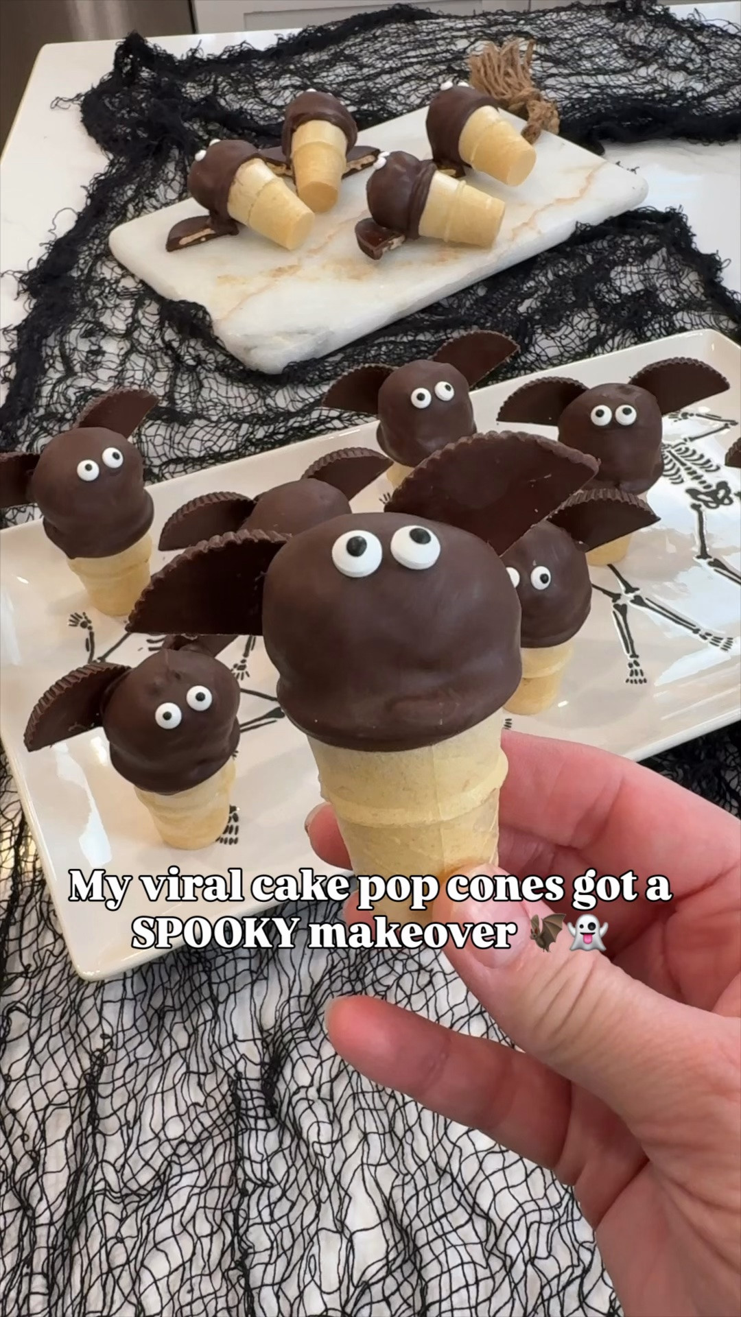 🦇🍫 My viral cake pop cones got a Halloween makeover!! These Chocolate Peanut Butter Bat Cake Pop Cones are such a fun spooky-season treat — and they’re way easier than they look! 👻

Dip mini ice cream cones in melted dark chocolate, add a mini Reese’s inside to help weigh them down, then top with a chocolate donut hole. Once set, dip again and add candy eyes + Reese’s dark chocolate thins cut in half for the bat wings. 🦇

Perfect for Halloween parties, school celebrations, boo baskets or a fun treat to make with the kids! 🎃🍫

#LTKFamily #LTKHalloween #HalloweenTreats #HalloweenDesserts #SpookySnacks #EasyHalloweenTreats

#LTKSeasonal #LTKHome #LTKfoodie