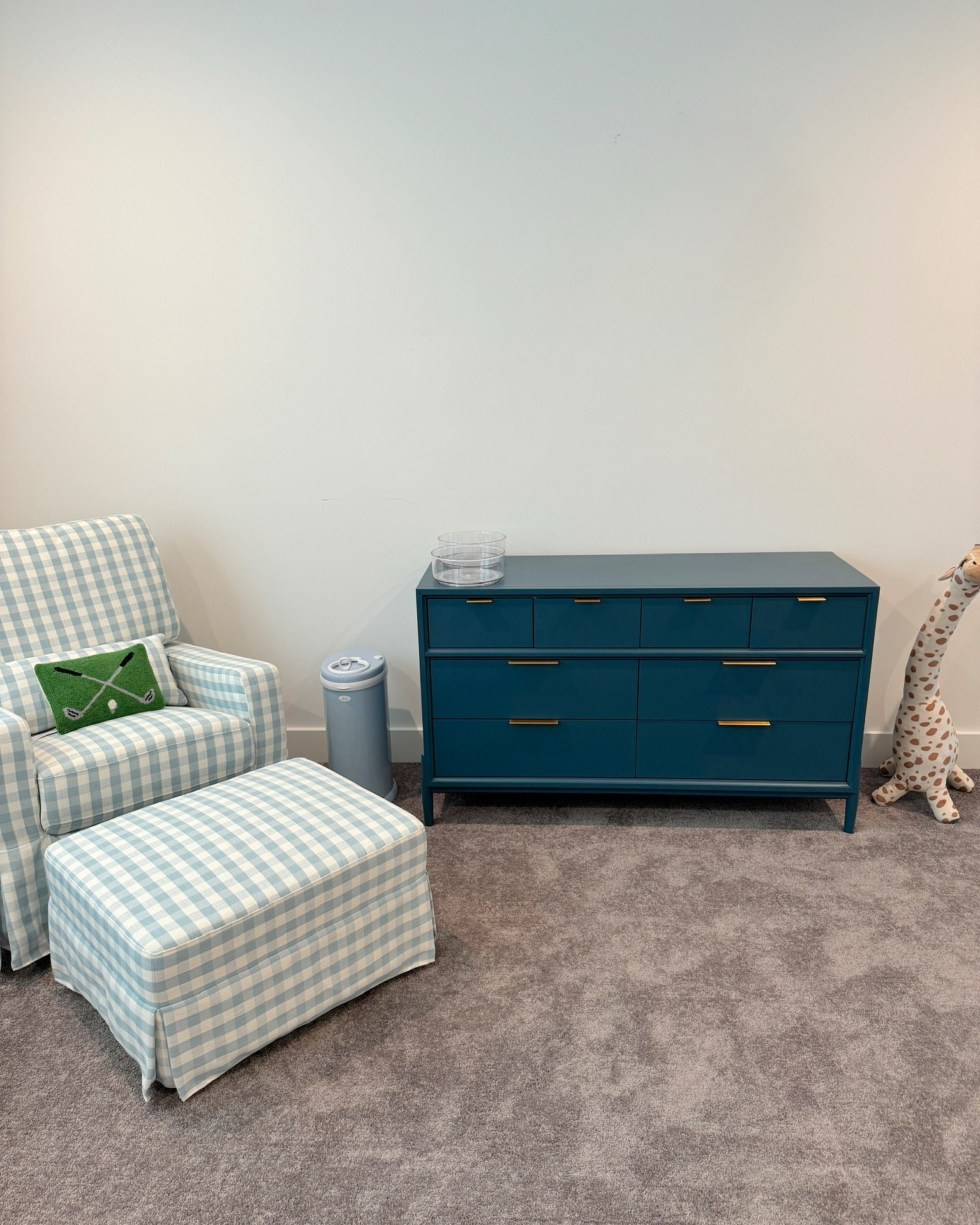 Baby boy nursery - blue and white gingham swivel glider chair and gliding ottoman, golf pillow, cloudy blue ubbi steel diaper pail, crate&barrel kids 8 drawer blue dresser, 3 ft giraffe from H&M, acrylic lazy susans 

#LTKHome #LTKBaby #LTKKids