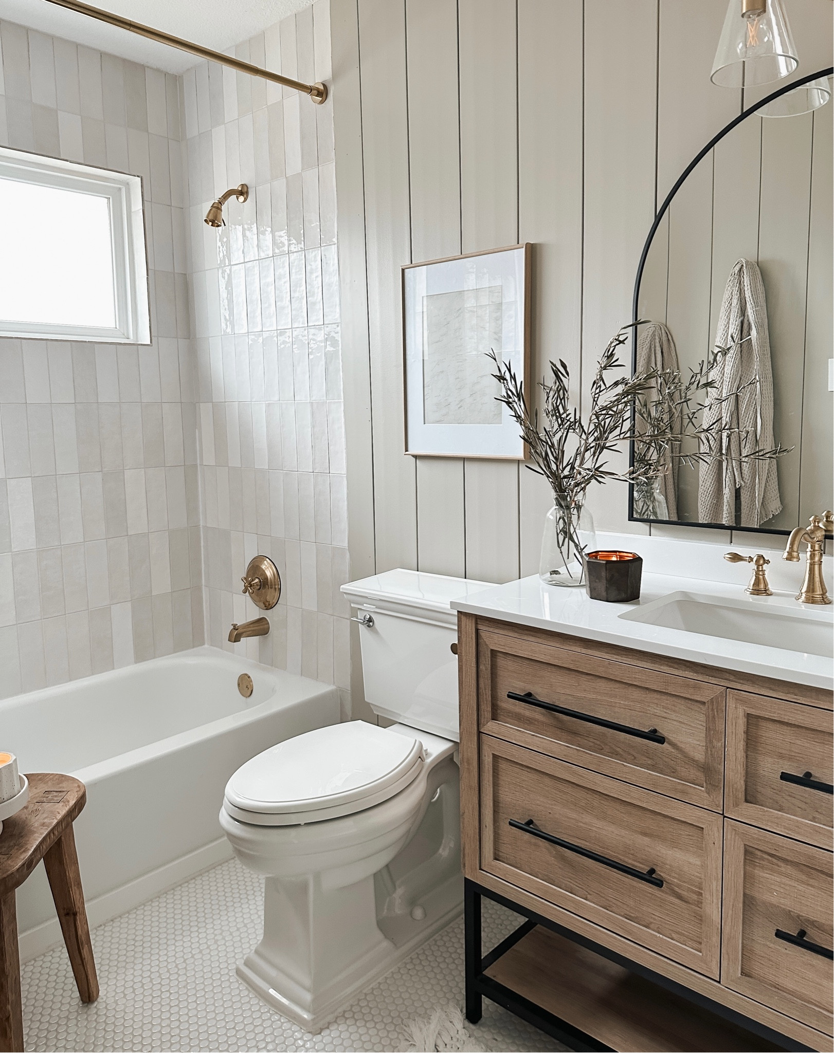 Linking up all I can from our guest bath renovation! 

Arch mirror, kohler toilet, gold light fixture, olive stems, wood vanity, abstract art, zelliage tile, penny tile

#LTKhome #LTKfindsunder50 #LTKfindsunder100