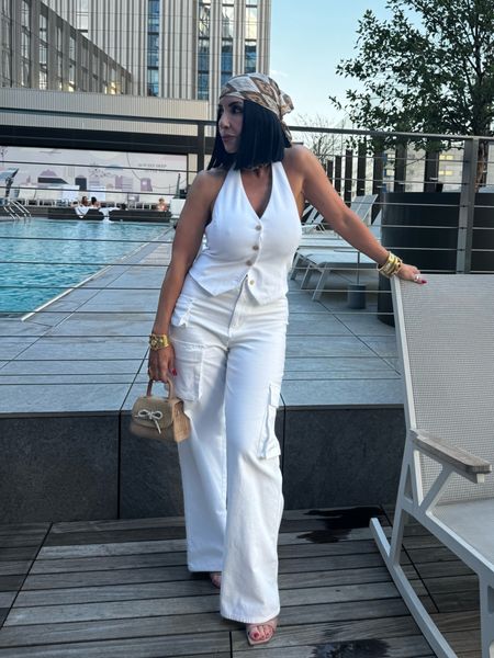 Halter Vest 
White cargo Pants 
Nude Jimmy Choo Heels 
Raffia Bow Bag 
Hard Scarf
Pinky nude lipstick 

#LTKOver40 #LTKBeauty #LTKStyleTip