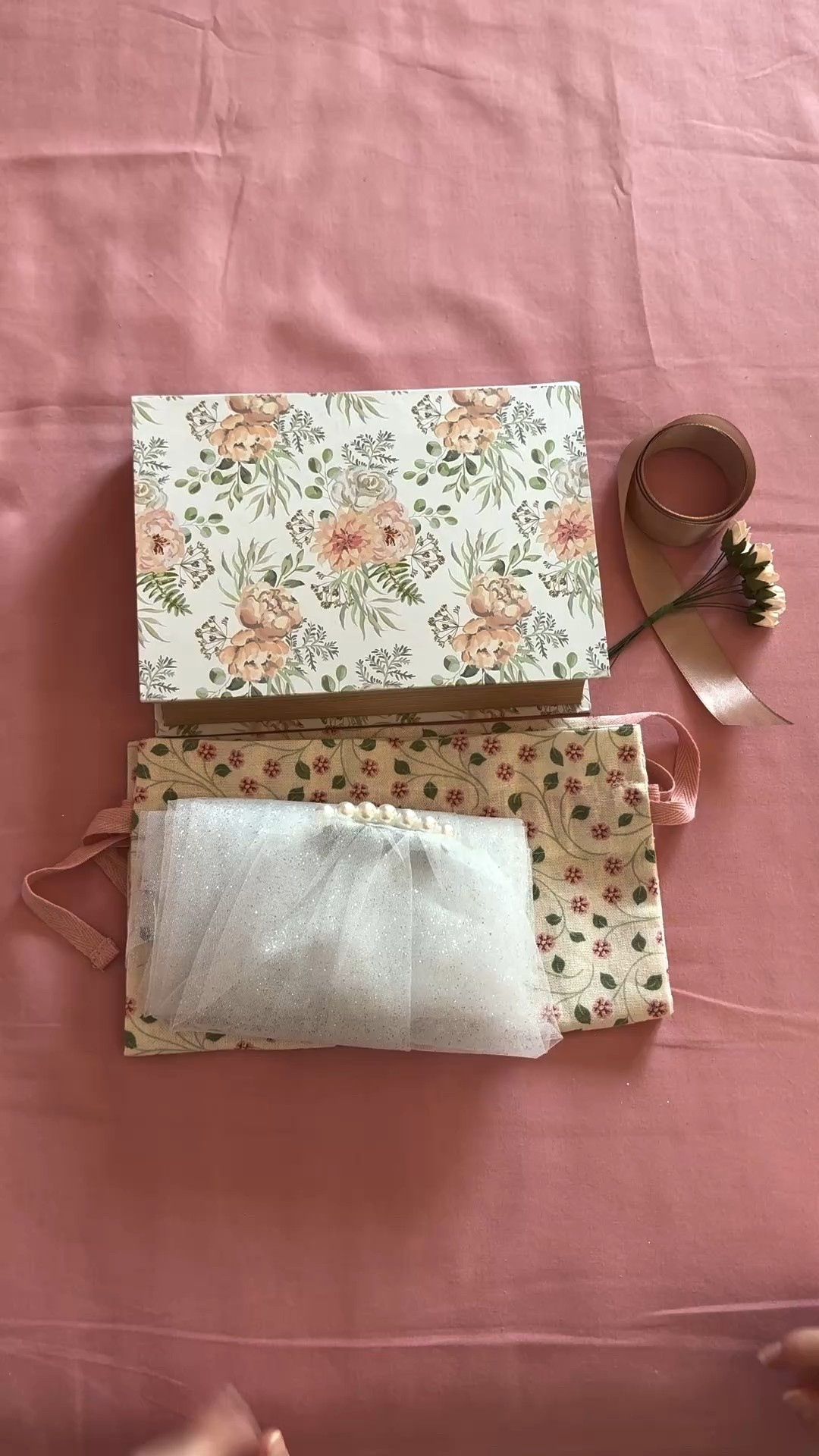 It’s wedding season so I thought to show you all the DIY projects I made as a maid of honour to my best friend’s wedding! So pack with me the handmade veil I made for my best friend for her bachelorette! Actually I made two, one for the bride that got married last October and I was the maid of honour and one for the bride that will get married this July!
Both packages were identical, only the box was different.
I handmade both veils. I bought glittery tulle fabric, sew-on pearls and hair barrette clips. I handsewn first the clip on the fabric and then handsewn the pearls as well. 
Each veil has the initials of the couple embroidered and something that symbolises their nicknames from their husbands.
If you are wondering, no I didn’t know how to embroider before this! I’m just delusional and I thought “How difficult can it be? If others can do it, I can do it as well!” 😂 I made it indeed but it took a few tries and a couple of days to make them presentable 😝 I used a marker to mark the design and went over it with the thread. Keep in mind that you can only do a straight line because it’s visible from both sides so it need to look neat. 
What to you think about the handmade veil?

#LTKwedding #LTKeurope #LTKpartywear