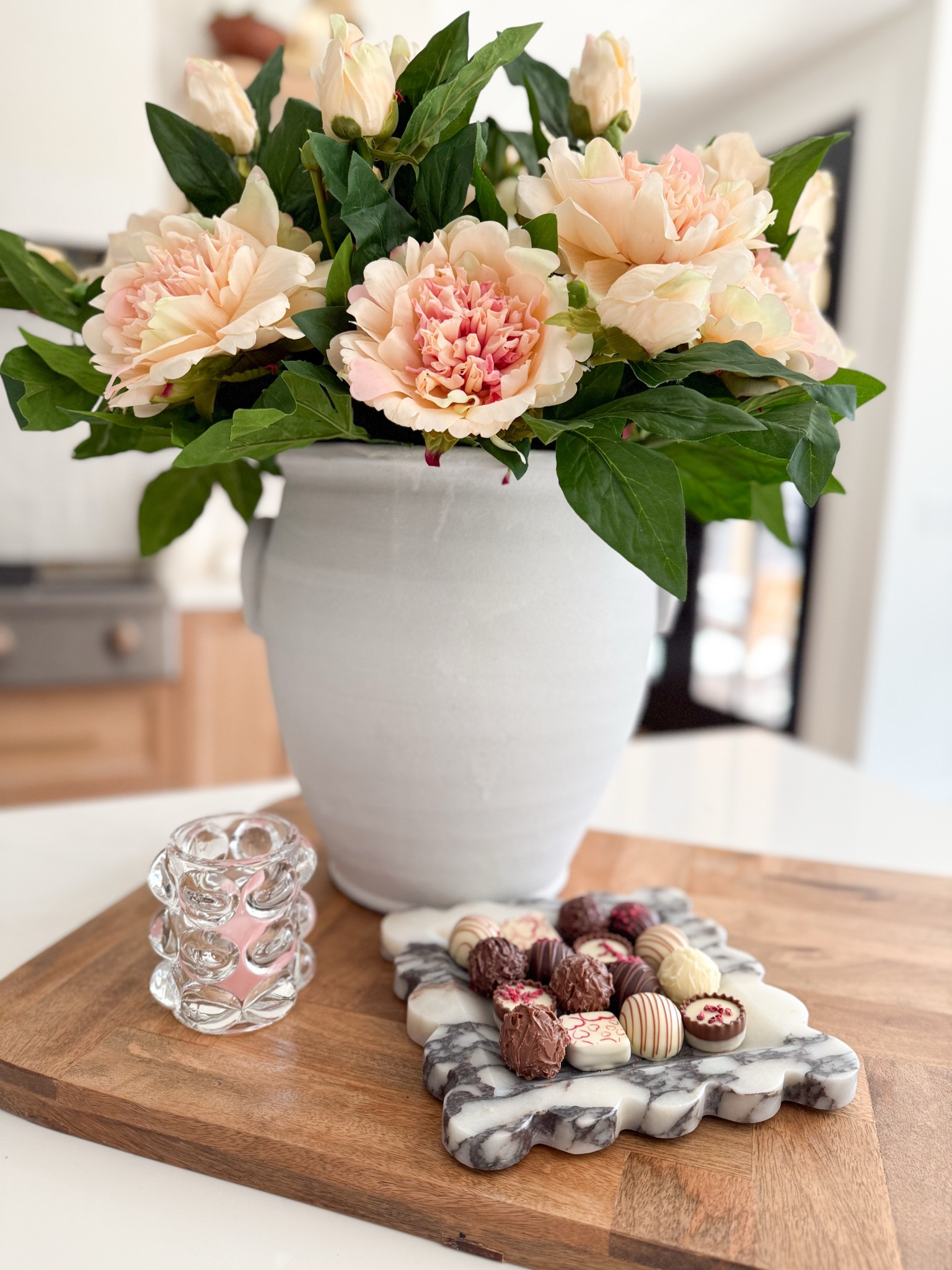 I’m super picky when it comes to my faux florals—they *have* to look and feel real. These peonies from Alice Lane? Total perfection. They’re so lifelike, I almost forget they’re not fresh! And how gorgeous is this marble tray? Styled it with chocolates for Valentine’s Day, but it’s elegant enough to keep out all year. Here’s a peek at my Valentine’s Day kitchen island decor idea! ✨ #ValentinesDayVibes #FauxFlorals #AliceLaneHome #fauxpeonies #marbletray #kitchenislandstyling #luxurydecor #transitionaldesign #homedecor #ad

#LTKHome