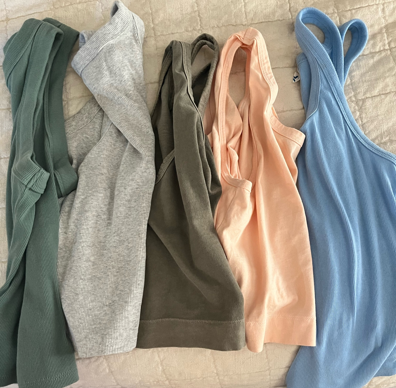 Old navy tanks on sale. New summer tank tops some cropped some not! Blue one is activewear and normal sizing. I sized up in the other ones to a M. 

#LTKunder50 #LTKSeasonal #LTKsalealert