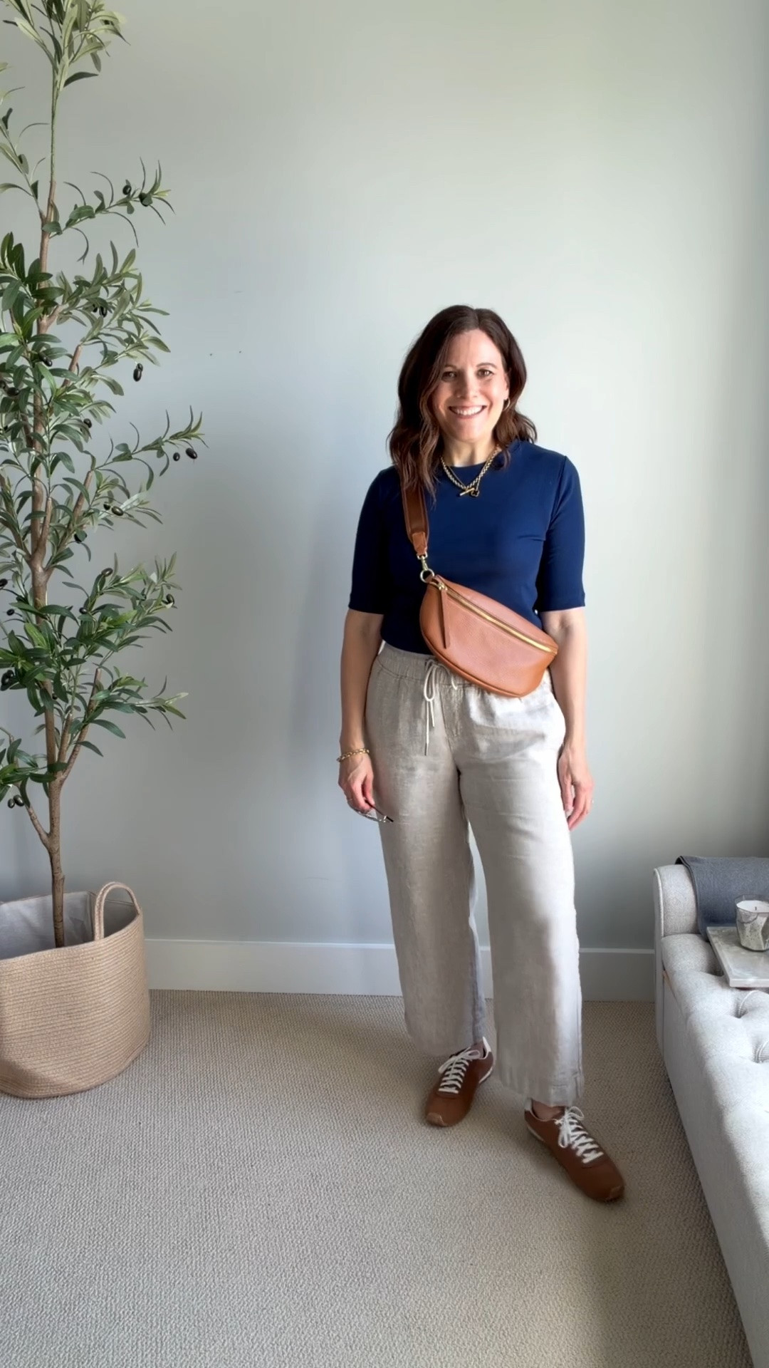 This is one of those outfits that looks polished and put together, but it’s incredibly simple. I’m wearing a navy elbow-length tee tucked into khaki linen pants with cognac suede sneakers and a matching cognac crossbody bag.
These wide leg linen pants from Quince fit true to size. I’m in a medium in the 28 inch inseam. ￼

#LTKSaleAlert #LTKOver40 #LTKMidsize