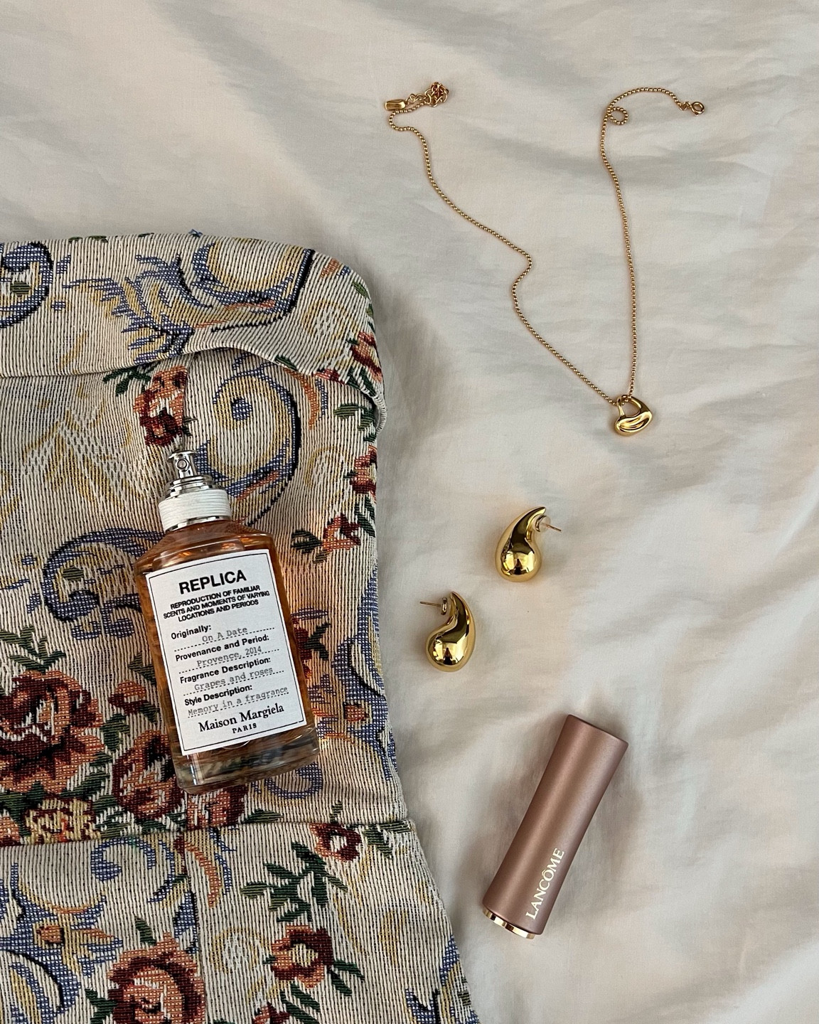 Margiela perfume , teardrop earrings , heart necklace, gold jewelry, lipstick , lancome 

#LTKbeauty