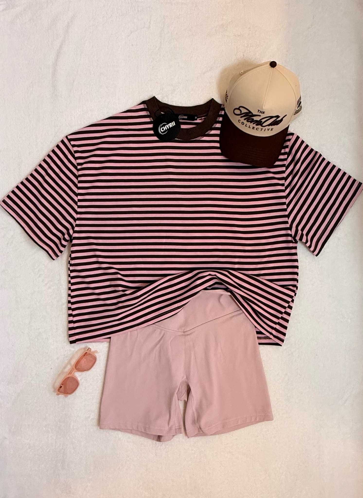 Easy weekend uniform loading 🤎🩷 This oversized striped tee is giving effortless summer style — pair it with unissu 6’ pink bike shorts for a comfy but put-together look. Topped it off with the cutest “Mom Club Collective” trucker hat (obsessed with this one, moms 🙋‍♀️) and my go-to pink sunglasses from @SOJOS VISION (use SYLWIASOJOS on Amazon to save) 
Perfect for school pickup, errands, or just living that Polish Mom in AZ life ☀️ 
	•	🤎 CHYRII Oversized Striped Tee (pink/brown, crewneck, Y2K-inspired) medium
	•	🩷 High-waisted workout/bike shorts — Rhodonite Pink in medium
	•	🧢 “The Mom Club Collective” trucker hat — cream/brown, family owned
	•	🕶️ Pink tinted sunglasses

oversized striped tee, mom trucker hat, pink bike shorts, casual mom outfit, summer streetwear, Y2K stripe top, comfy mom style, athleisure outfit

#LTKmomlife #LTKActive #LTKTall