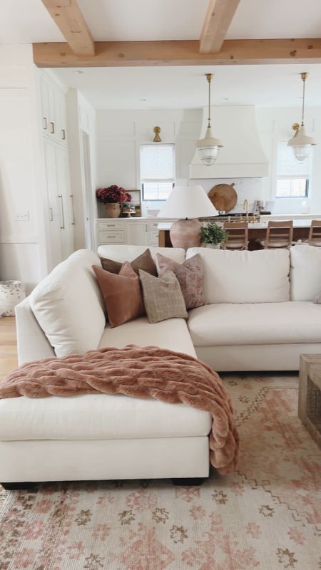 Spring living room reveal with pops of pink, warm whites, and natural wood tones. These warm pink tones are the perfect accent for a warm spring look 

Spring refresh, living room reveal, light and bright, aesthetic home, gold detail, pops of pink, creamy whites, furniture faves, vase details, coffee table, faux florals, floor mirror, accent chair, throw pillow, throw blanket, neutral home, sectional style, spring decor, Pottery Barn style, spring home, shop the look!

#LTKSeasonal #LTKstyletip #LTKhome