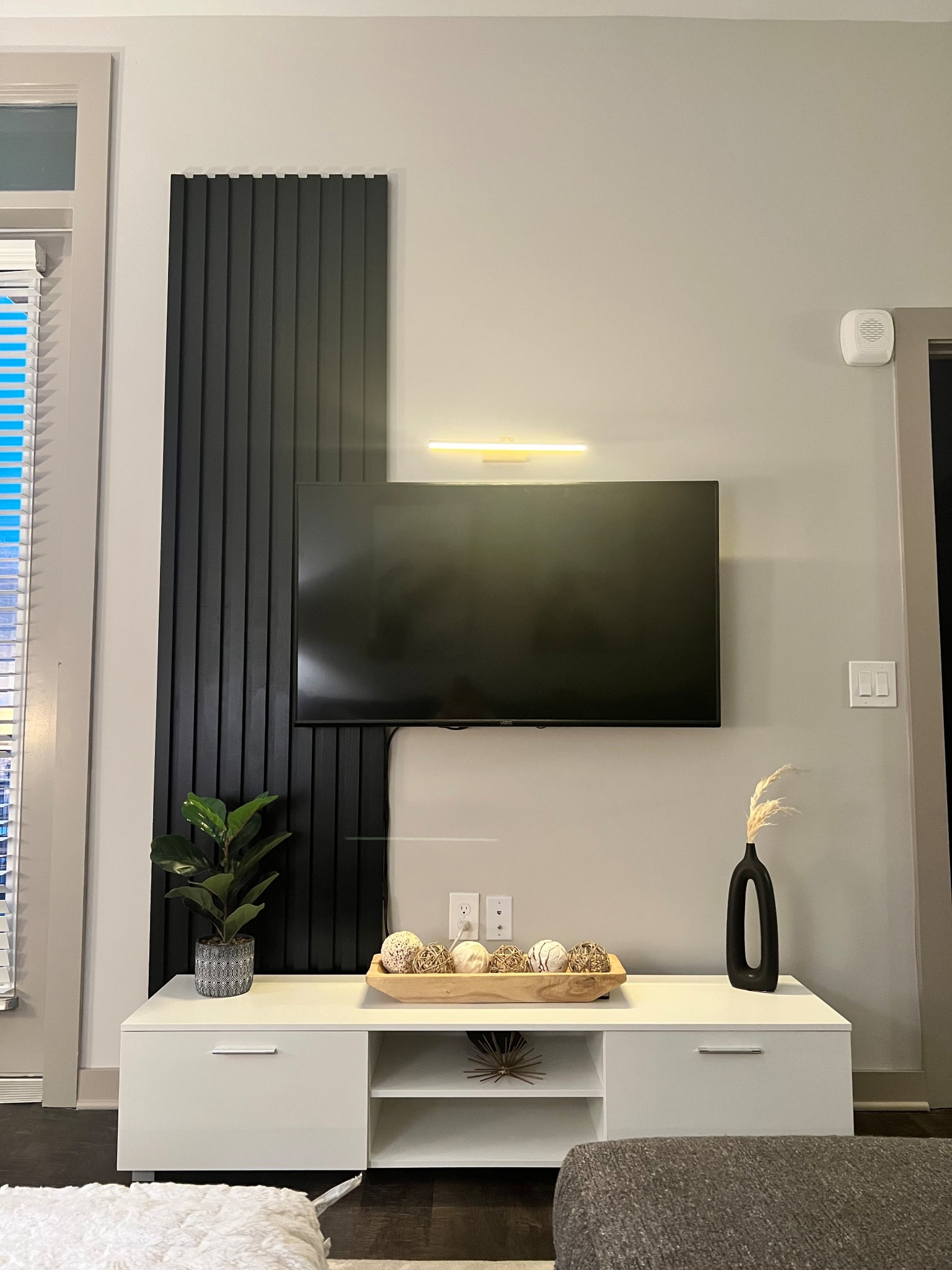 Modern TV stand that fits an apartment space perfectly! Add a little light above your TV to give it some extra flare ✨

#LTKdayinmylife #LTKHome #LTKSaleAlert