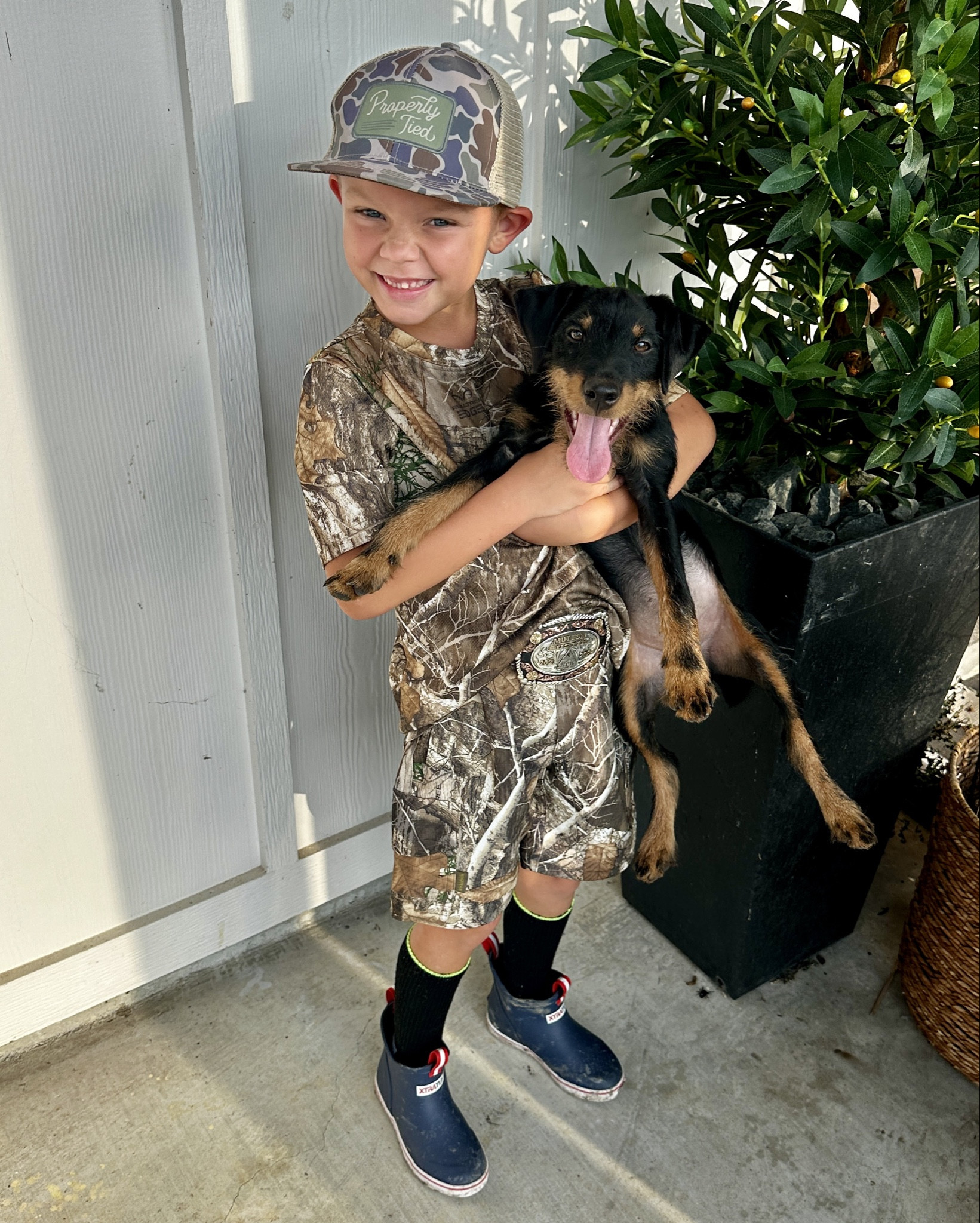 Just a boy and his hunting dog! 🐶 The boys went dove hunting this weekend. I snapped a quick photo of the hunting gear he loves to wear. These outdoor deck boots are his favorite. The camo pants zip off and become shorts, perfect for all seasons. 

Youth camo Hunting attire | deck boots | burbelo caps | camo | kid style | hunting season 

#LTKMens #LTKStyleTip #LTKKids