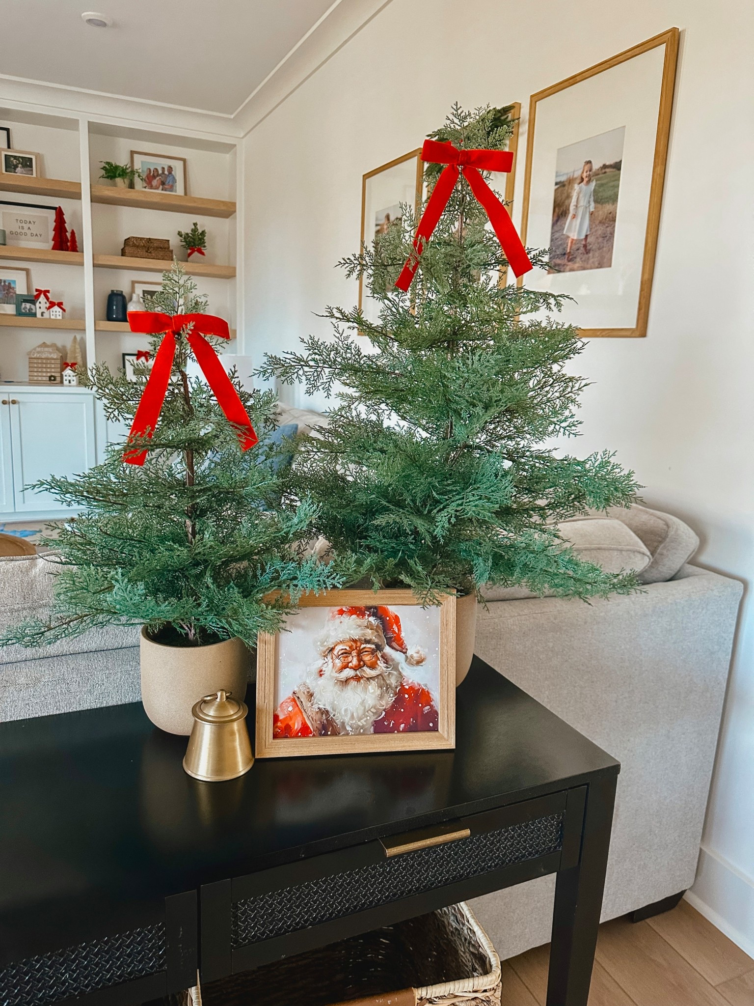 holiday living room decor, Christmas home styling, festive console table decor, mini Christmas trees, red velvet bows, Santa art print, cozy holiday home, neutral Christmas decor, simple holiday decorating, modern traditional Christmas, living room holiday inspiration, Christmas greenery decor, holiday vignette ideas, seasonal home accents, Christmas shelf styling, cozy living room ideas, holiday decor finds, warm neutral holiday style, Christmas decorating ideas, festive home inspiration, LTK holiday home, budget friendly Christmas decor, holiday room refresh, classic holiday decor, subtle Christmas touches, Christmas greenery styling, cozy seasonal decor, living room Christmas inspiration, winter home decor, holiday decorating aesthetic

#LTKFindsUnder50 #LTKHoliday #LTKHome