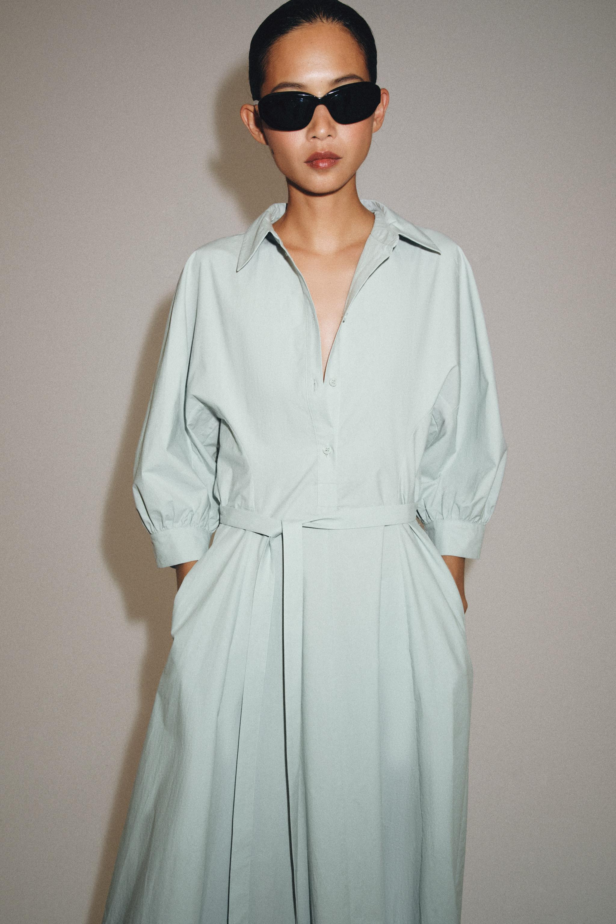 DescriptionCompositionMeasurementsHalter neck mini dress. Open back with tie detail. Featuring ru... | Zara NL