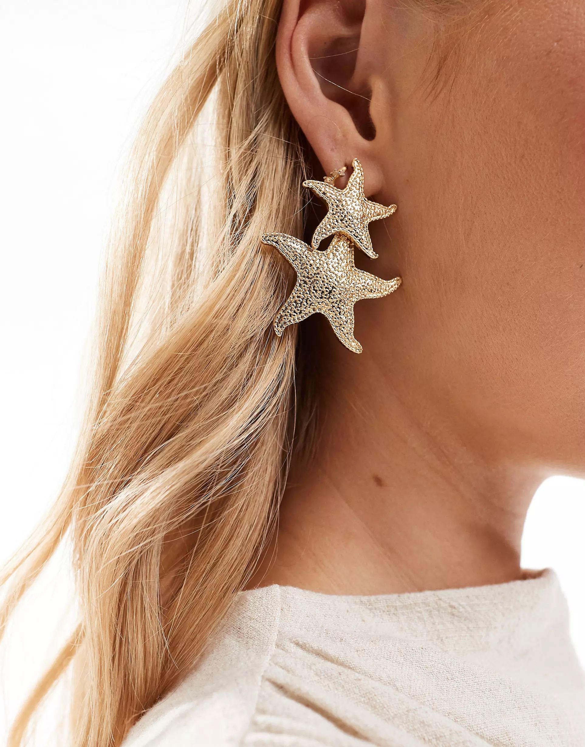 ASOS DESIGN door knocker drop earrings with starfish design in gold tone | ASOS (Global)