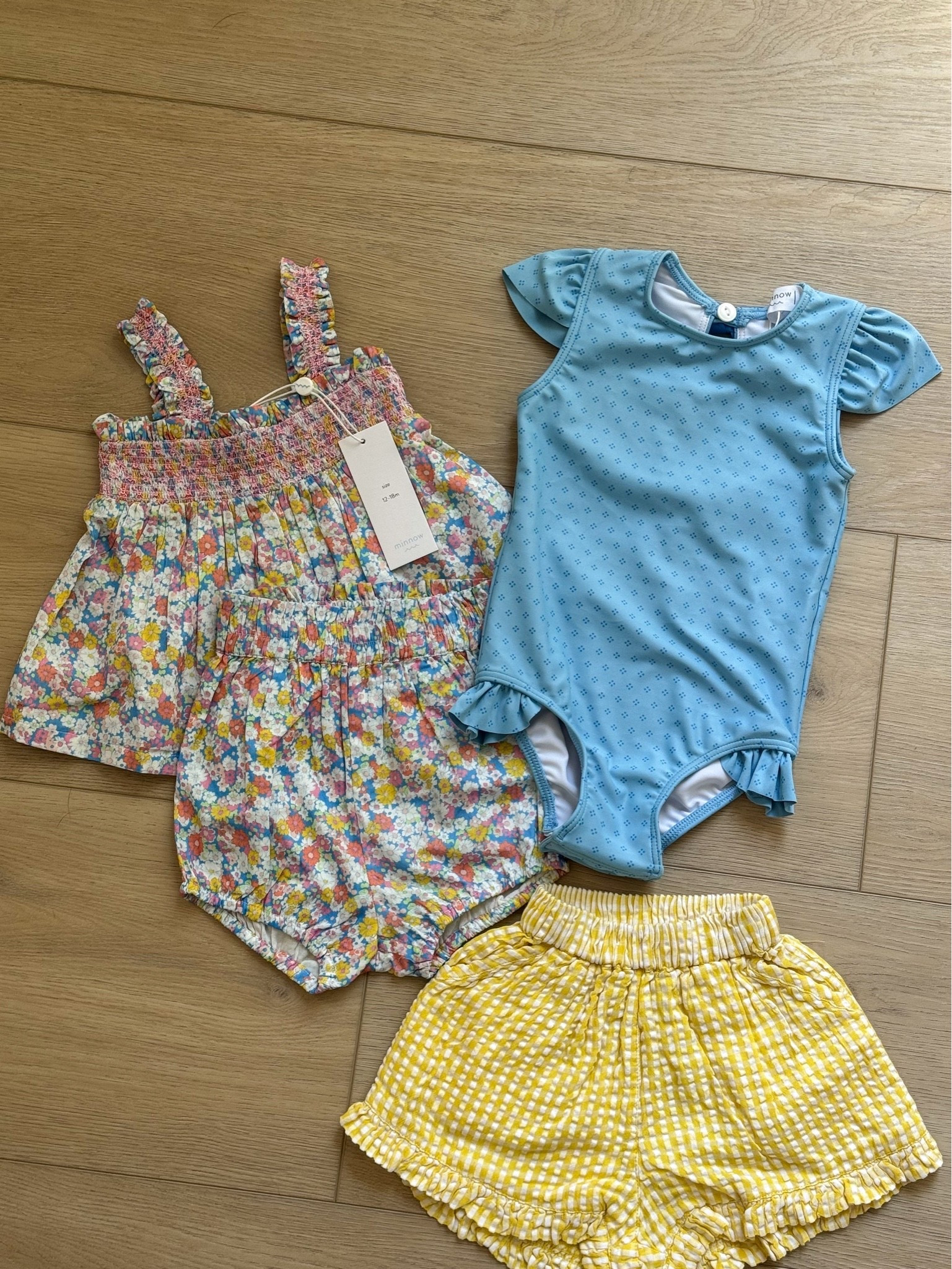 The cutest little summer finds for girls ☀️💛🌸

Obsessed with these sweet Minnow pieces — from the floral smocked set to the gingham ruffle shorts and adorable blue swimsuit. Perfect for beach days, vacations, and sunny everyday moments ✨

#LTKBaby #LTKKids #LTKSeasonal