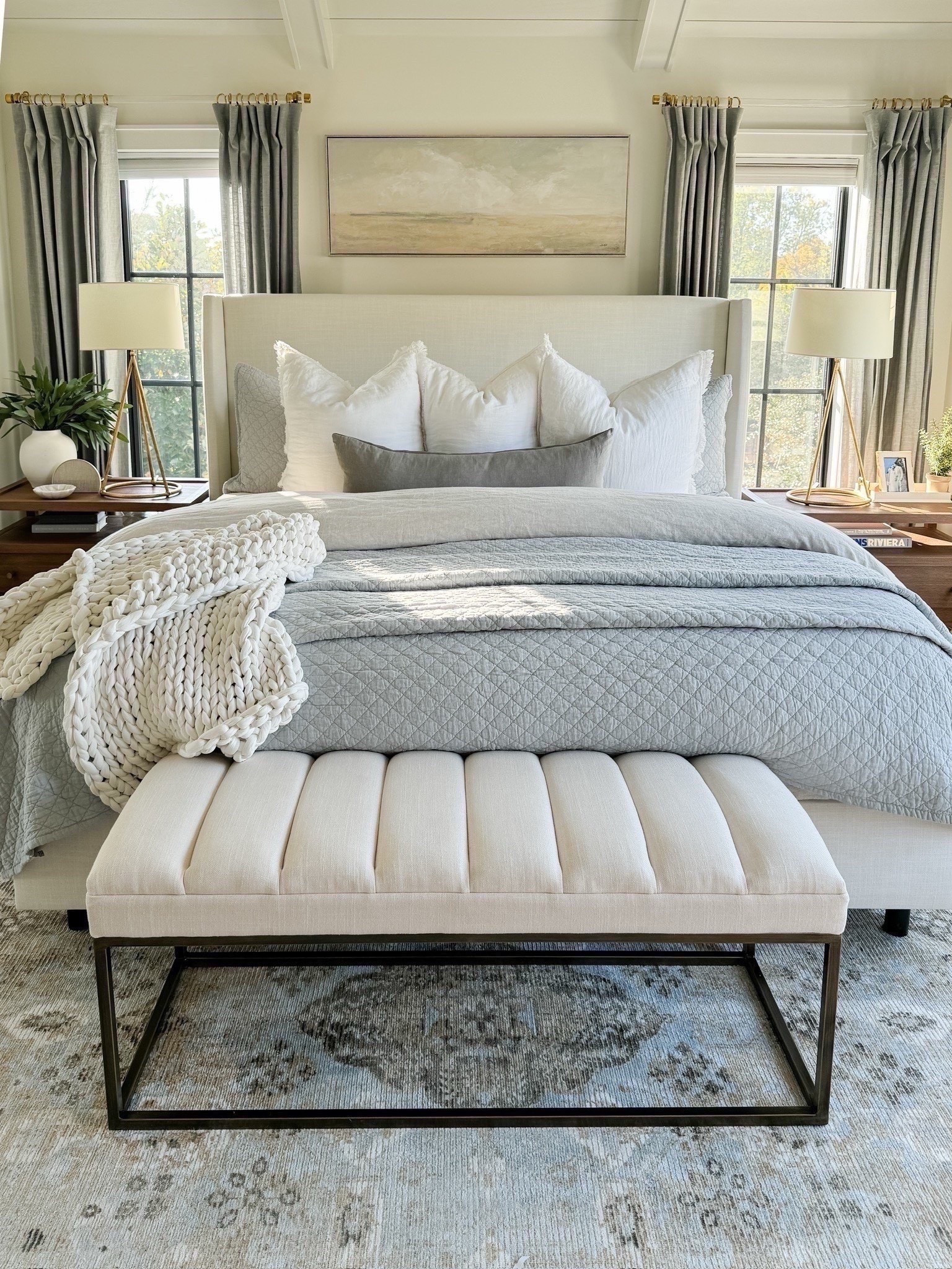 ▫️Paint color: Benjamin Moore Simply White
▫️Rug: 8x10 - it’s very soft and I love the muted vintage vibe!
▫️Bed: King size in Zuma White. We have a standard size boxspring and 12” thick mattress
▫️Curtains/Drapes: 84” length, 50” wide in mineral blue with light filtering lining 
▫️Curtain Rods: Acrylic & Brass with 1.25” diameter rings
▫️Art: I found it locally (preframed) but I’m linking the same art on stretched canvas in a similar size.
▫️Pillows: 4 king size bed pillows, 3 26” Euro pillows (from Amazon), 1 14x36” light gray lumbar pillow
▫️Chunky Throw: This is actually a 15lb weighted blanket in cloud white 

#LTKStyleTip #LTKHome #LTKFindsUnder100