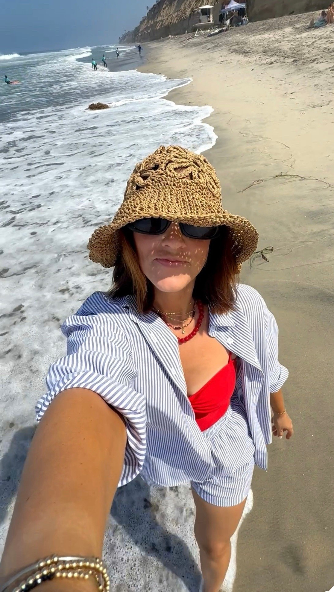 Beach day outfit! 💙✨🌊 I live in this striped set especially on vacation because you can wear the pieces together or separate! It’s flowy and comfortable and the shorts have drawstring waist, elastic and pockets! And they are lined!

**wearing size small in striped set
- swimsuit - size medium