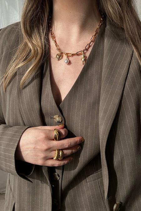 Loving this pinstripe three piece suit… I added some statement jewellery for a little trending touch ❤️‍🔥❤️‍🔥
M&S popular | Pinstripe waistcoat | Pleated front trousers | Oversized blazer | Brown | Workwear | Office outfits | Statement jewellery | charm necklace | sacred heart

#LTKuk #LTKspring #LTKworkwear
