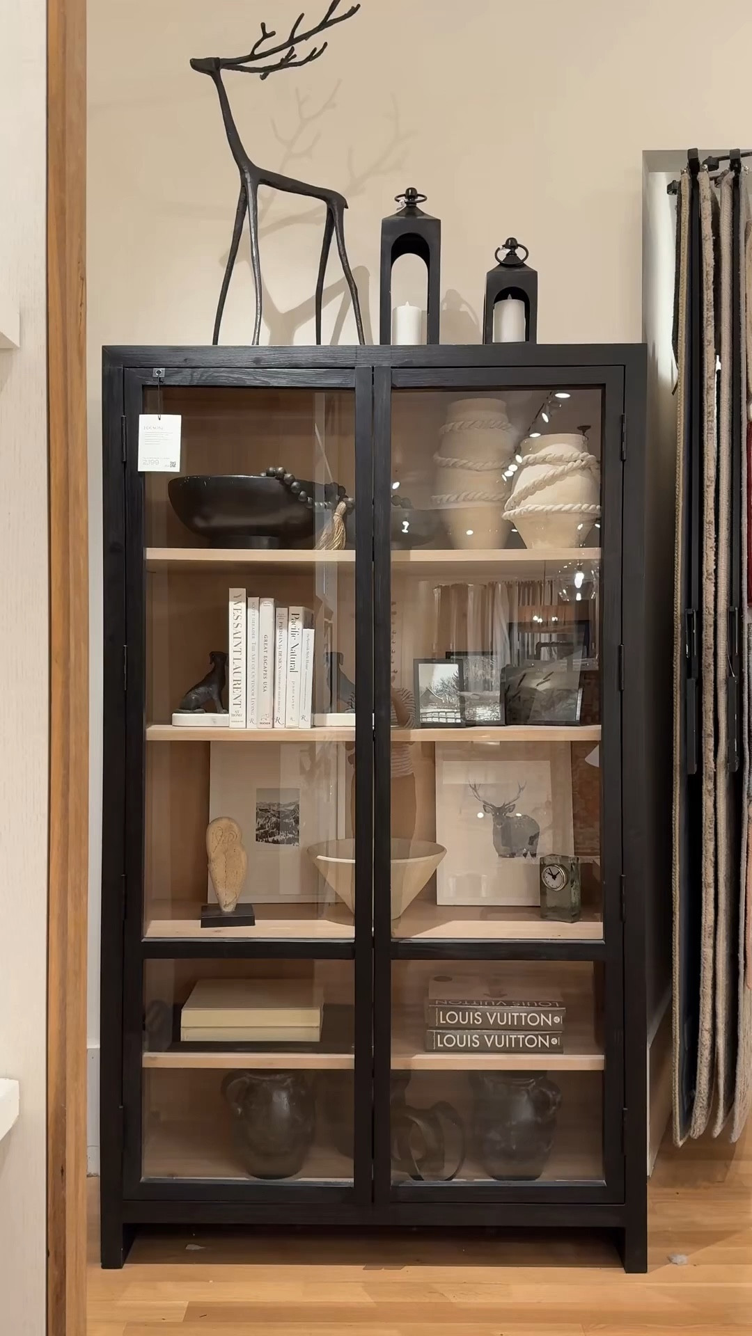 A sleek storage moment! 🖤 The Folsom Glass Cabinet from Pottery Barn is such a beautiful balance of modern and warm. I love the contrast between the light and dark wood finishes paired with the glass doors—it feels elevated and refined. ✨ The adjustable shelves make it easy to style with books, art, and decorative accents while keeping everything looking curated and intentional. 💫 I linked this piece along with other similar cabinet styles to explore! #PotteryBarn #HomeInspo #GlassCabinet 

#LTKFindsUnder100 #LTKHome #LTKSaleAlert